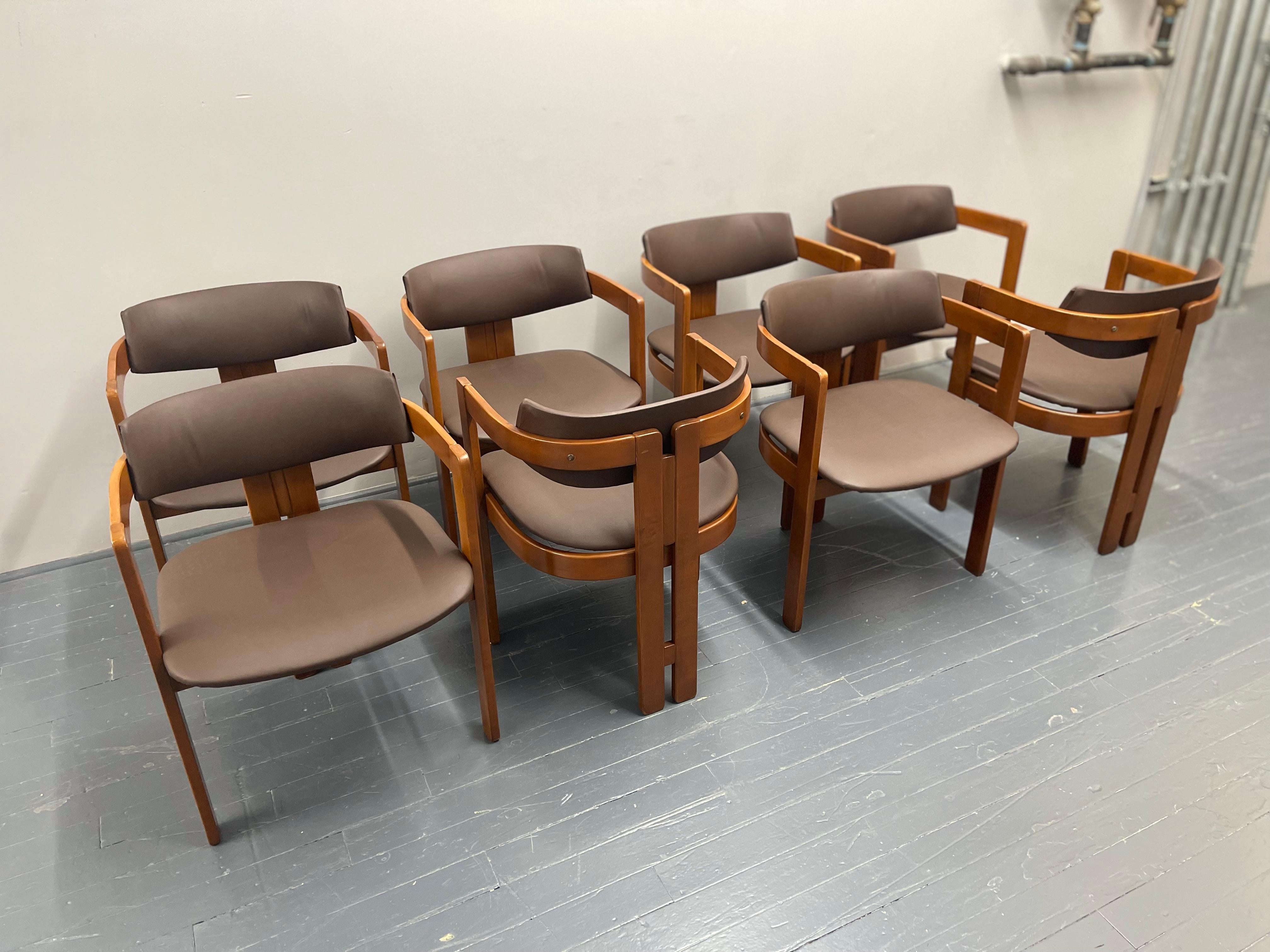 Set of 8 dining chairs Pigreco designed by Tobia Scarpa & Emilio Mantese – a true embodiment of timeless elegance. Originally conceptualized in 1959, the Pigreco armchair showcases the meticulous artistry of its creators. The chairs boast gracefully