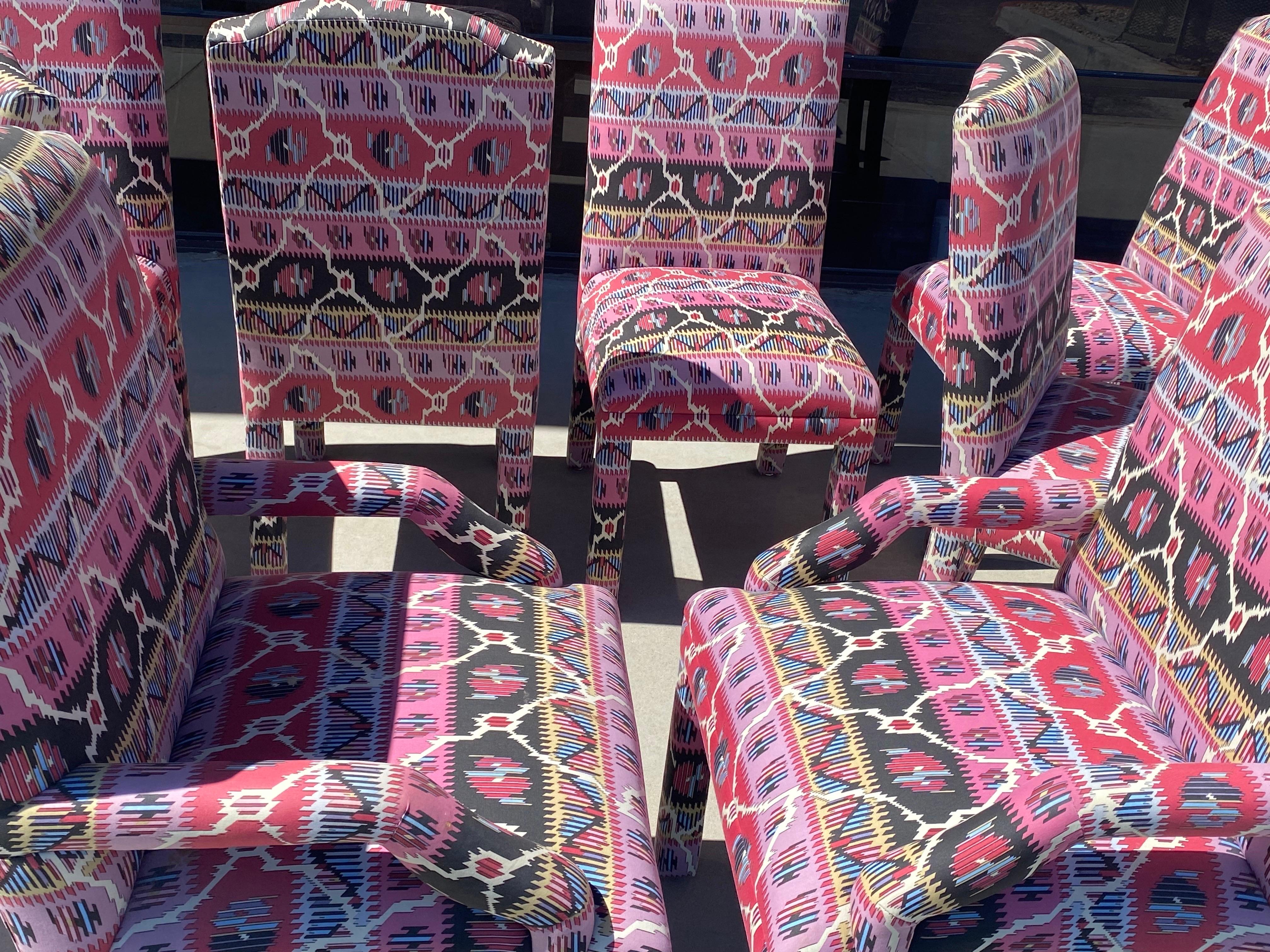 These beautiful dining chairs were custom-made for a high-end residence in Rancho Mirage California. The coloration of the Bohemian print is amazing in pink, black and white. The set consists of six armless chairs and a pair of host chairs.
The