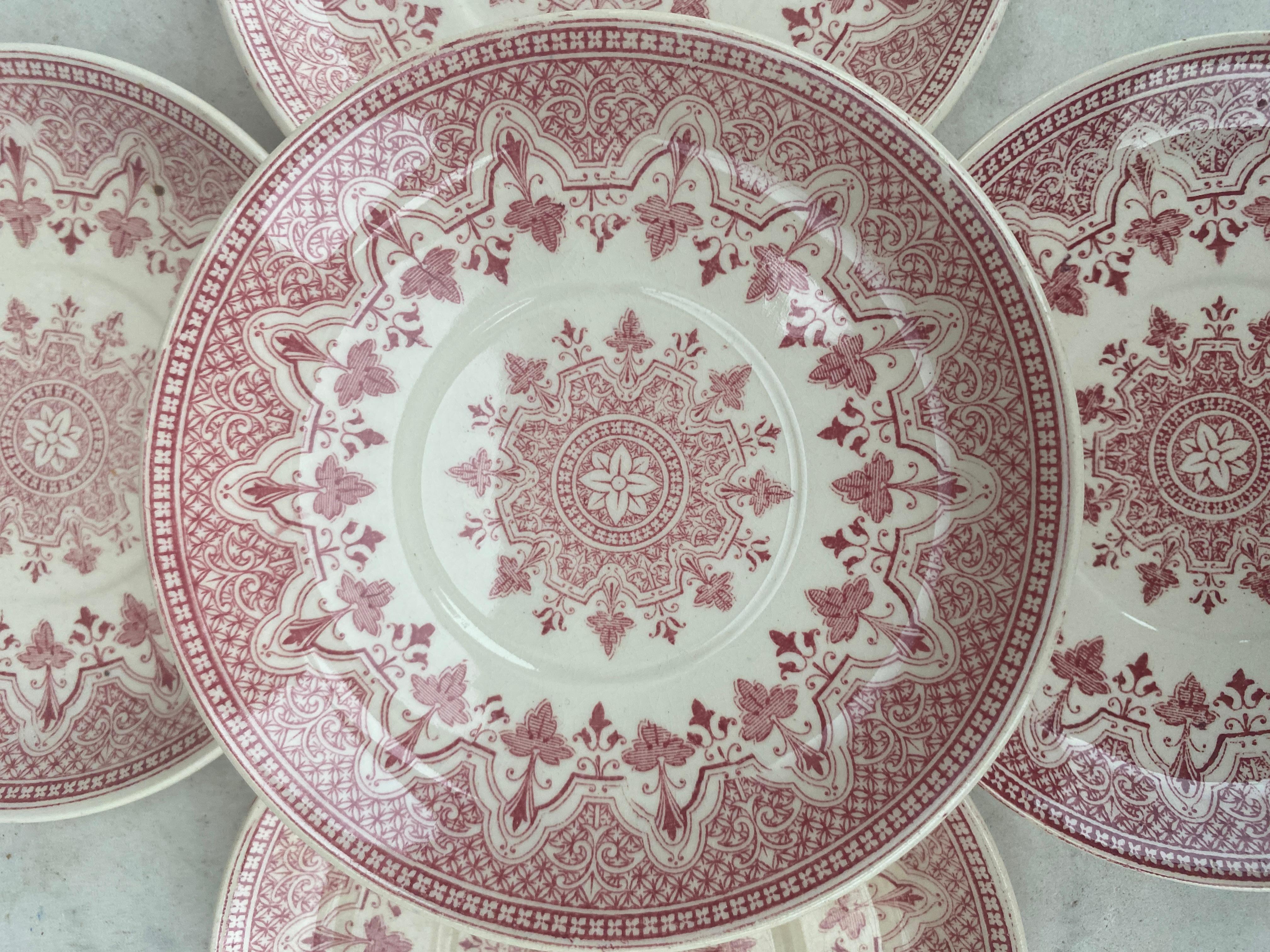 A rare set of 8 small plates with a geometric pattern signed Sarreguemines.
 