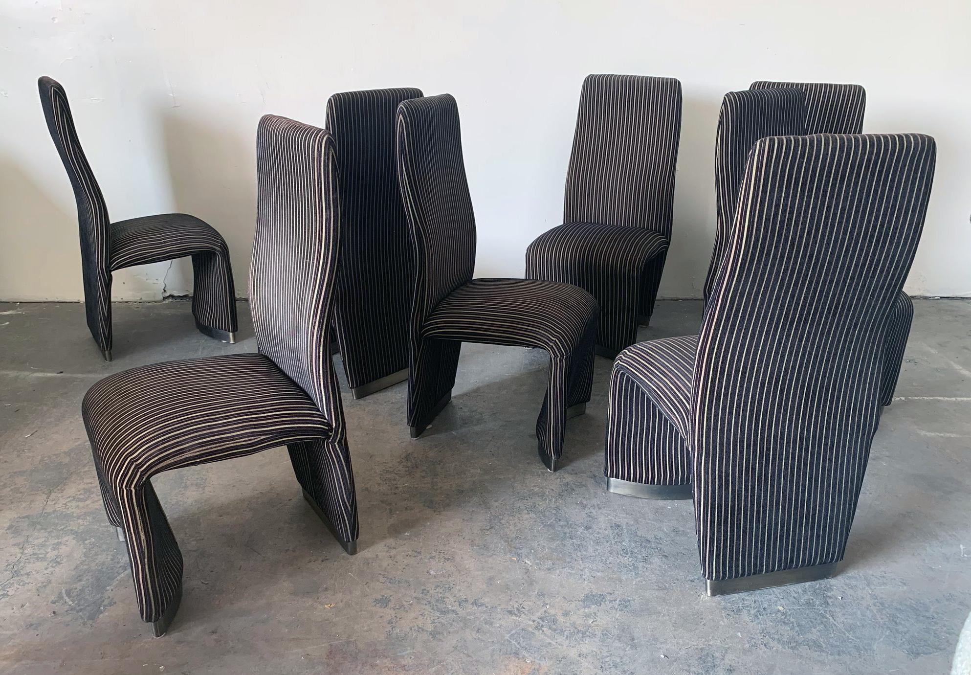 This set of 8 velvet Postmodern dining chairs is absolutely gorgeous. With an almost squiggle body frame and brushed nickel 