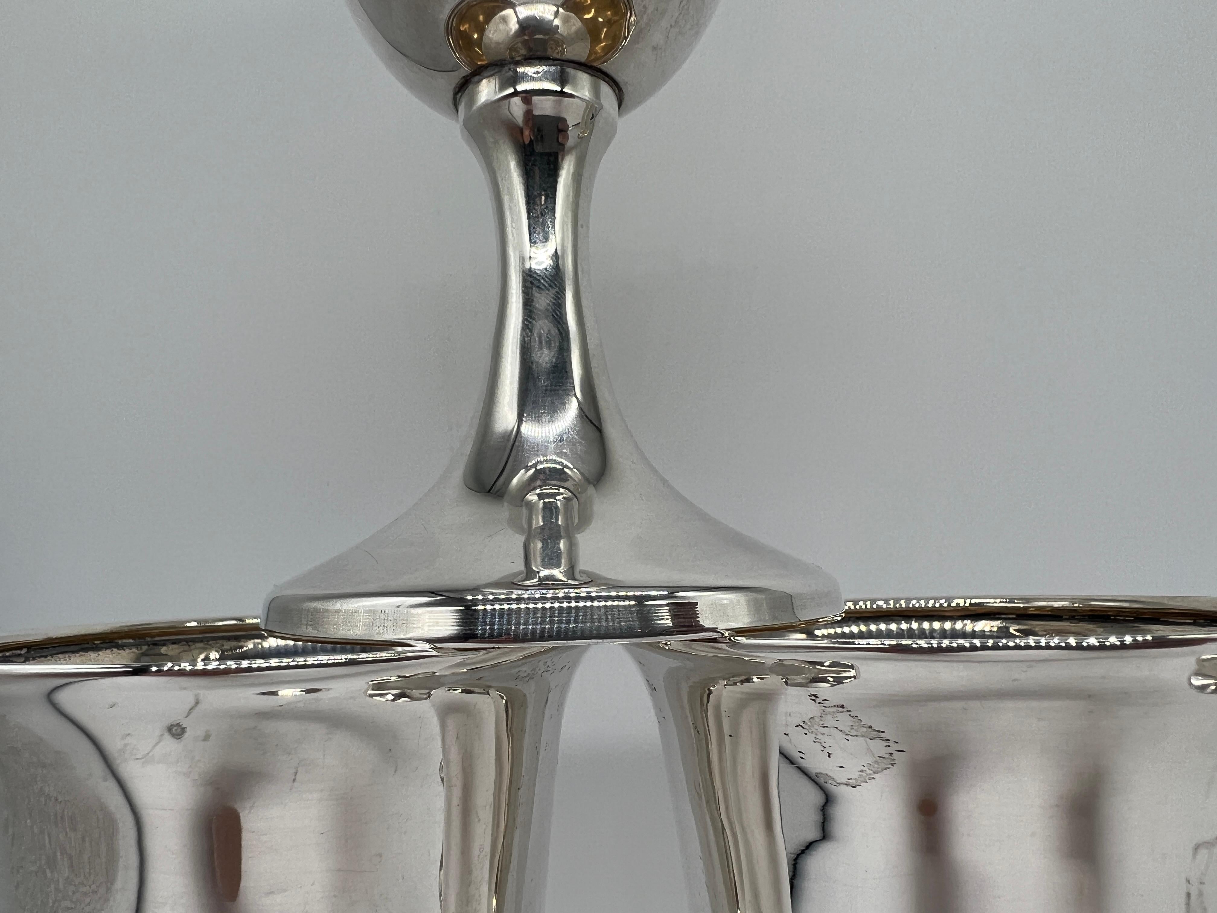 This exquisite set of eight sterling silver goblets, crafted by the renowned Revere Silversmith Company, exemplifies the elegance and refinement associated with early to mid-20th-century American silversmithing. Standing 6.25 inches high with a