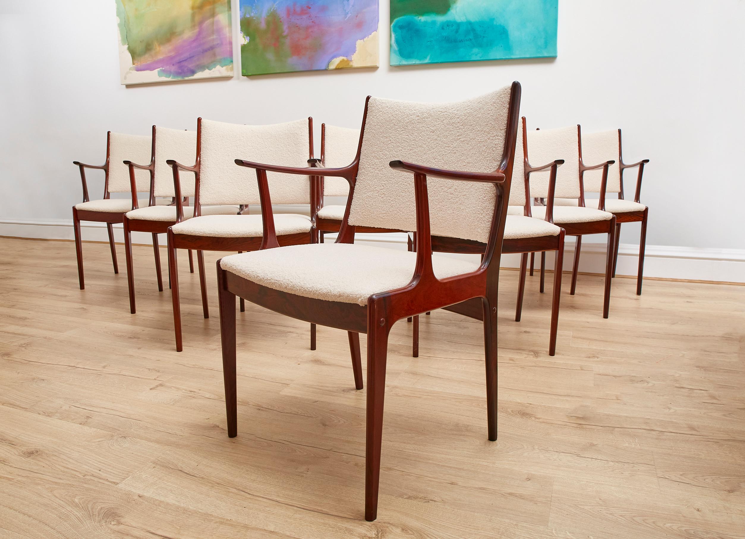 This Set of 8 Danish dining chairs by Johannes Andersen for Uldem Mobelfabrik in Rosewood are a testament to the craftsmanship of the mid 20th century, they capture the essence of the mid 20th century with their sleek lines and minimalist design,