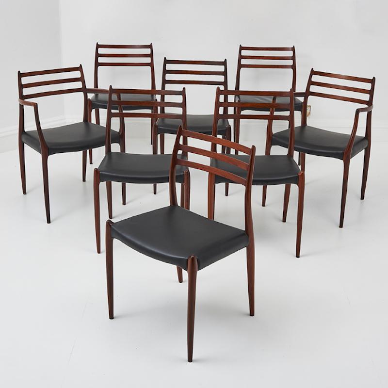 A rare set of Mid 20th Century Danish dining chairs with black leather seats and Rosewood frames, Model no. 78s. 

These elegant dining chairs were designed by Niels Otto Moller for the Danish manufacturer J.L. Moller, they exudes timeless elegance