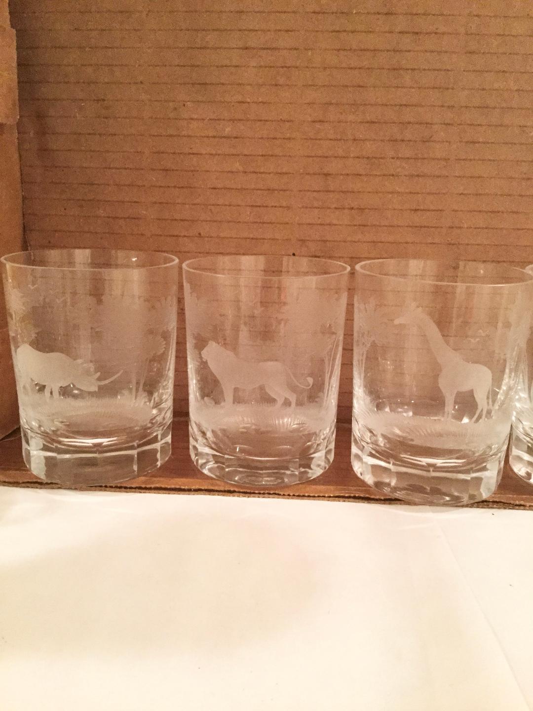 A set of 8 Rowland ward old fashion glasses from the Kenyan collection.
These glasses are handmade and cut by Moser in Bavaria with etched African Safari Animals with engraving of beautiful scenery around the animals. These have been packed away
