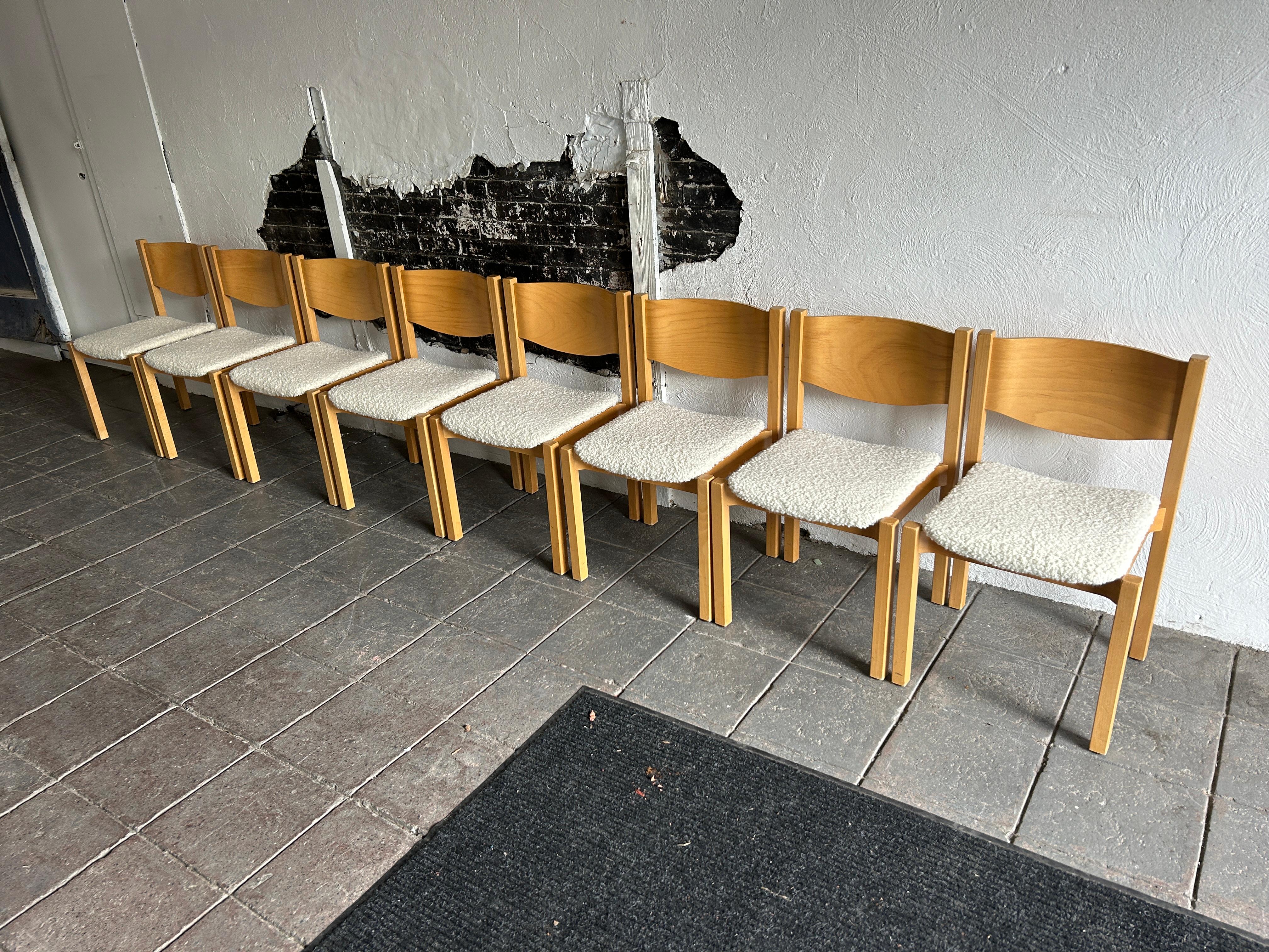 Set of 8 Scandinavian modern birch dining chairs in boucle Upholstery.

Sold as a set of 8 chairs 