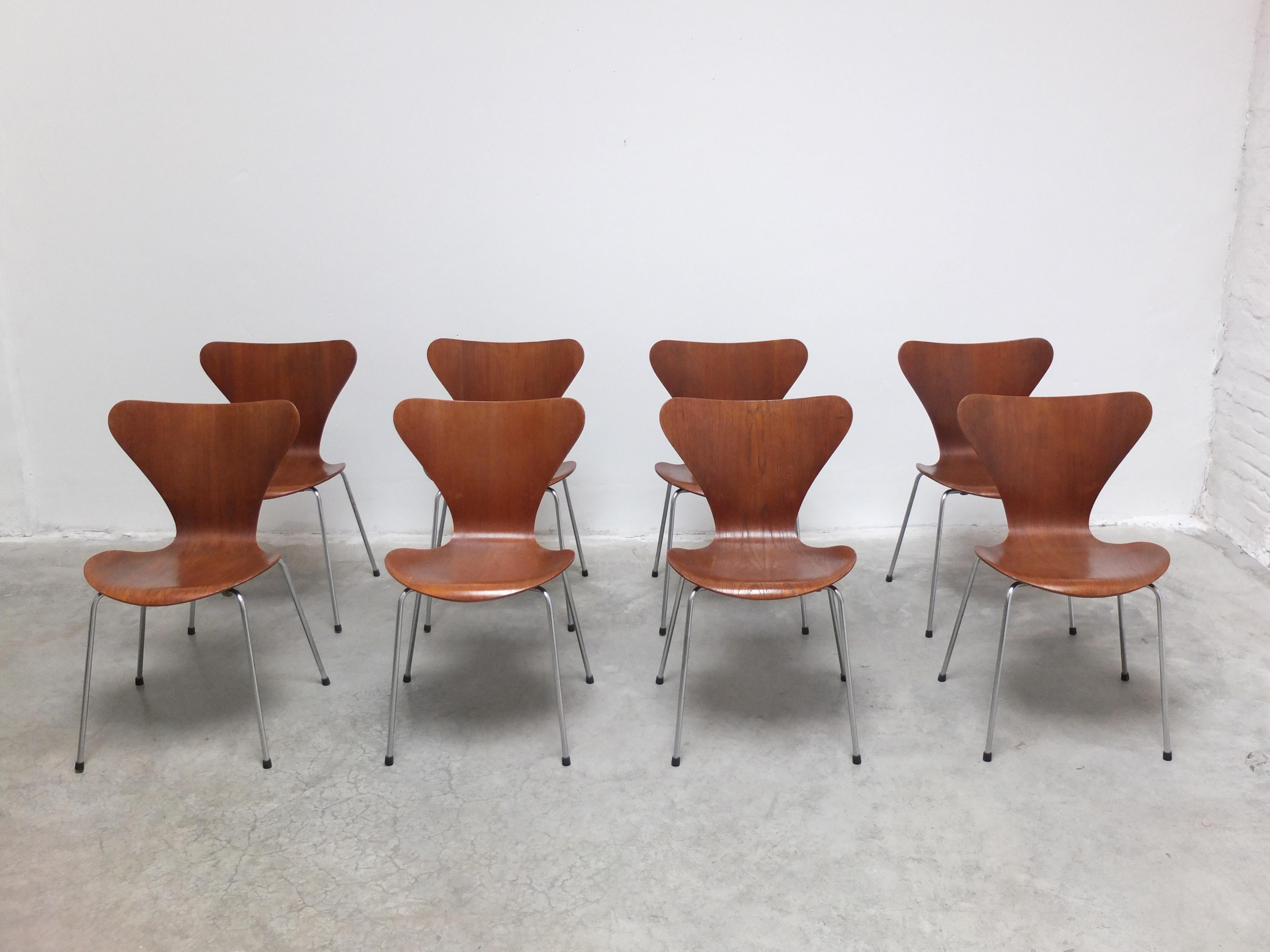 Exceptional set of 8 ‘Series 7’ dining chairs designed by Arne Jacobsen in 1955. These examples are early productions from 1968 made of beautiful teak wood. All chairs are in good condition with solid back supports and minor traces of use. Labeled