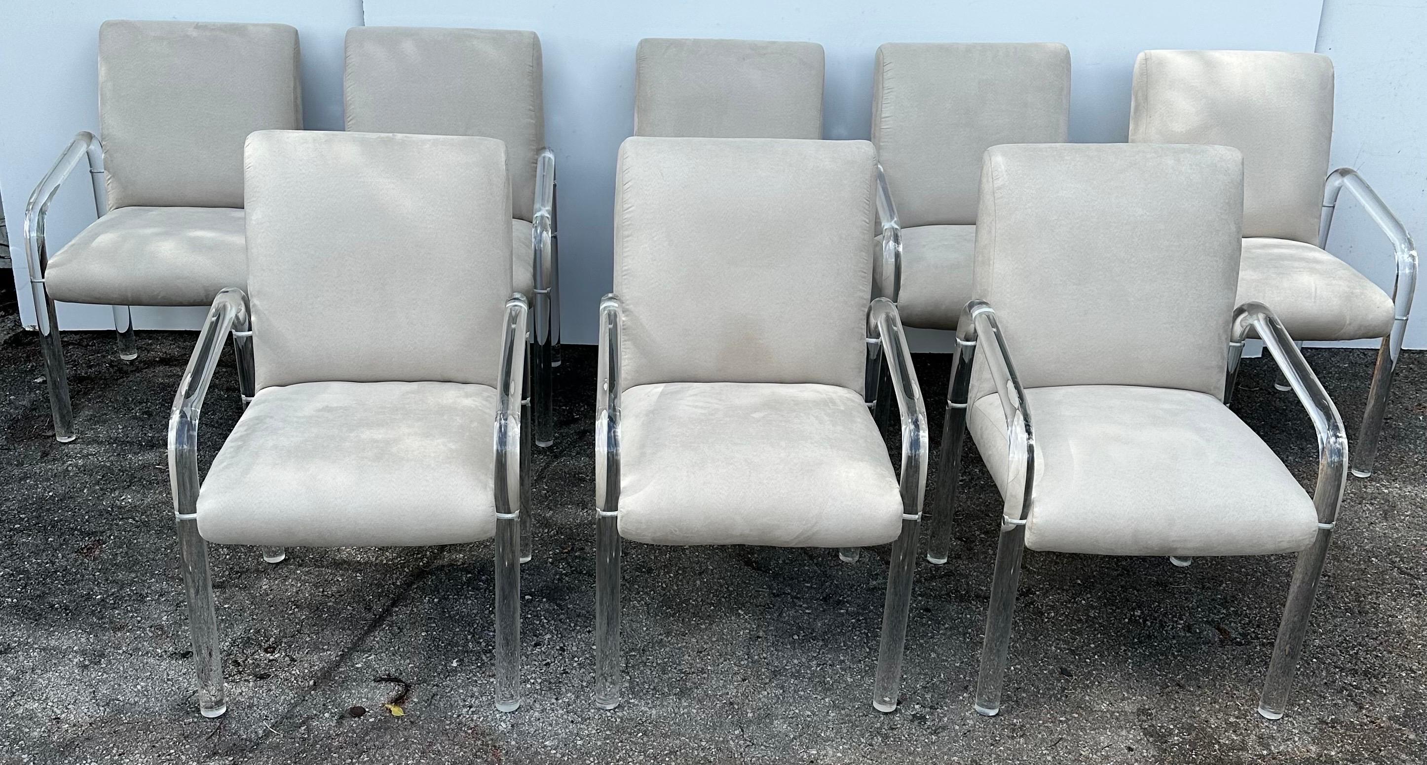 Set of 8 Lucite signed Lion in Frost Armchairs.
Newly reupholstered in beige ultra suede.