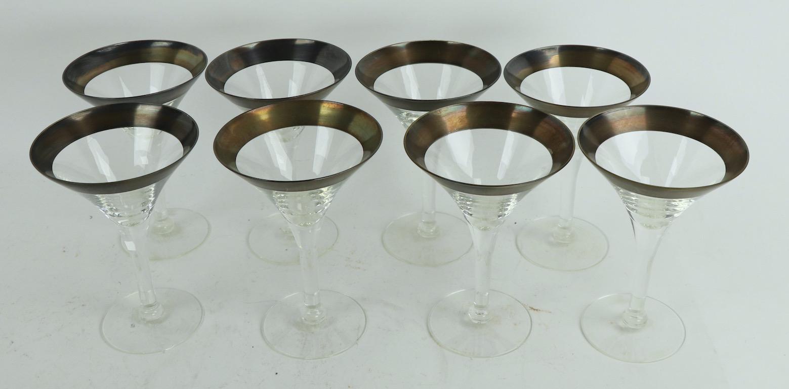 Elegant set of 8 silver band martini stemware glasses, all in very good ready to use condition, the epitome of cocktail hour chic. Priced and offered as a lot of 8, one stem has an inconsequential. Almost imperceptible pin flake at the top edge rim,