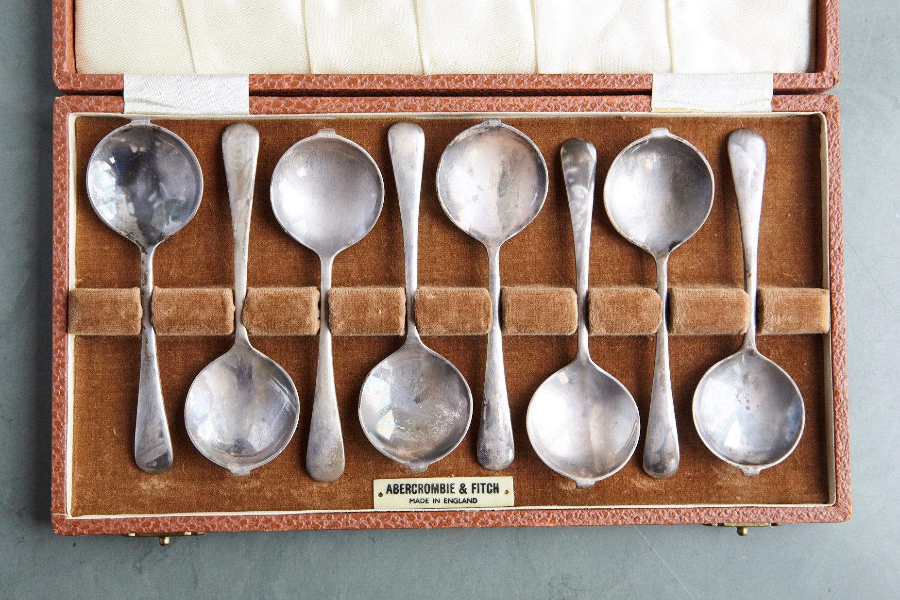 Lovely set of 8 silver plate Abercrombie & Fitch England small cafe diable spoons in a satin lined case, circa 1915s.
They are marked Abercrombie & Fitch - Made in England on the back as well on small plate in the satin lined box. 
There is a