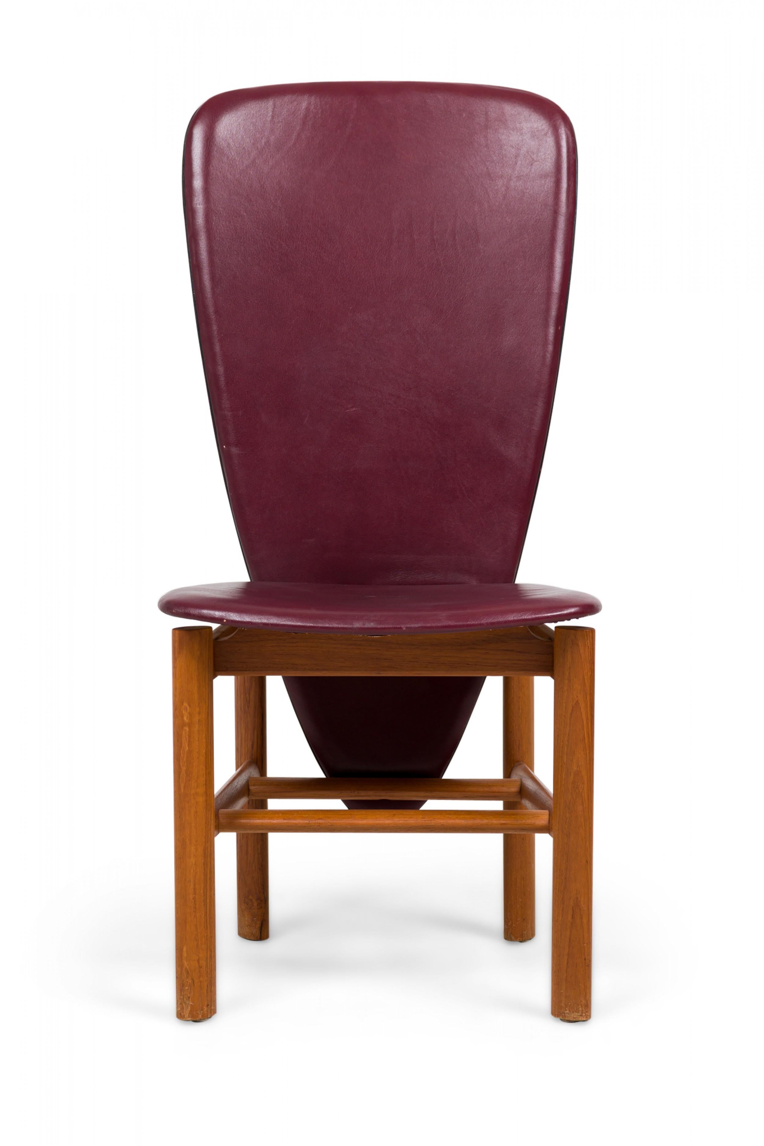 SET of 8 Mid-Century Danish Modern (1960) high back teak dining / side chairs with a tubular square form frames, elongated triangular backs with rounded corners upholstered in burgundy leather. (SKOVBY MØBELFABRIK) (PRICED AS SET).