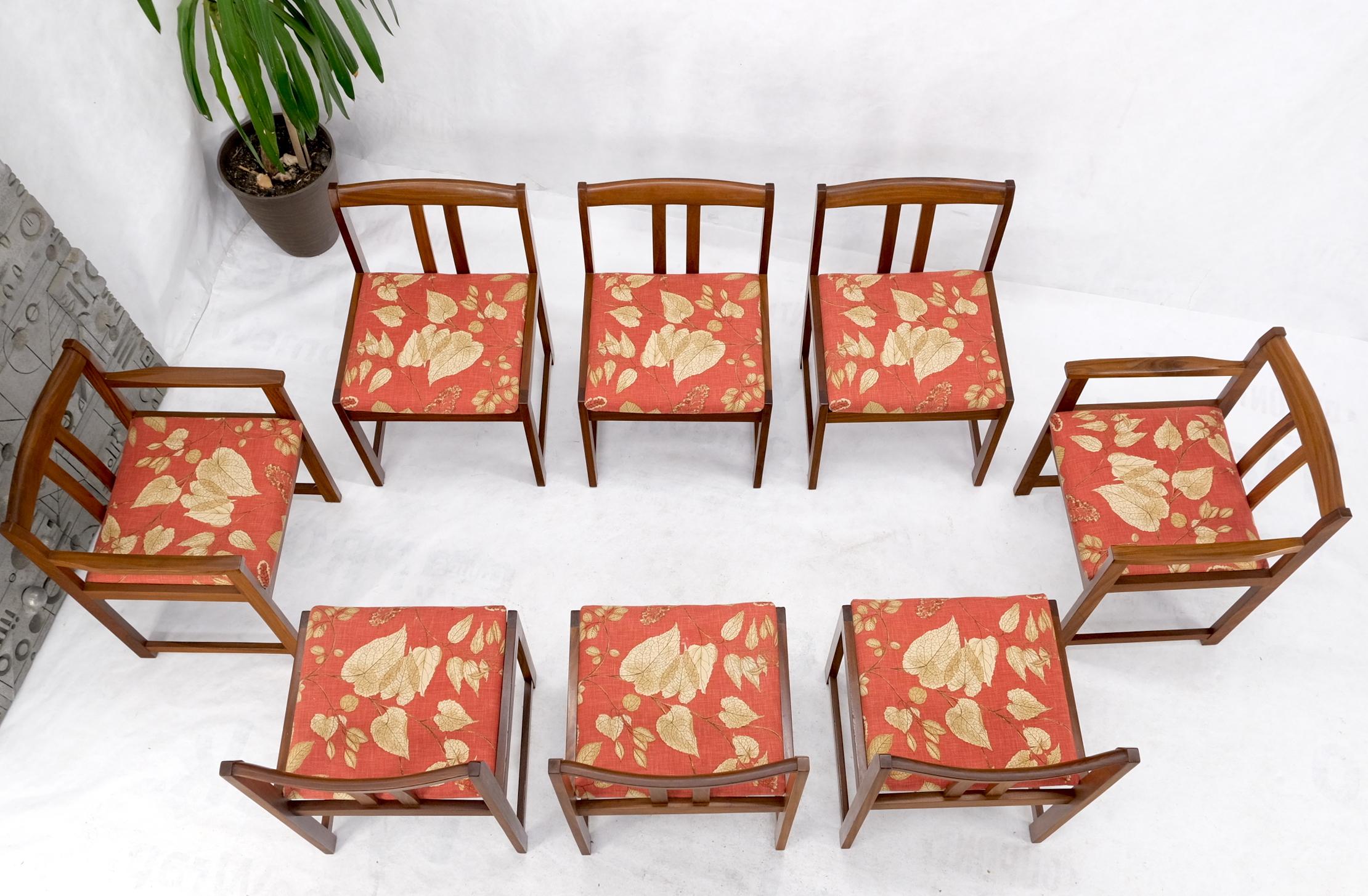 Set of 8 solid rosewood or teak red linen fabric upholstery dining arm side chairs.