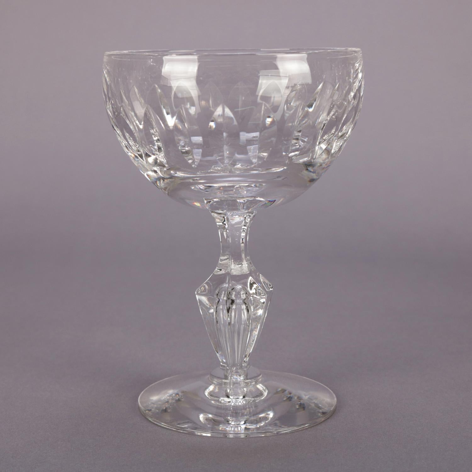 Set of 8 crystal sherbet glasses feature bowl with lower repeating stylized leaf pattern and raised on urn form stems, 20th century


Measures - 5
