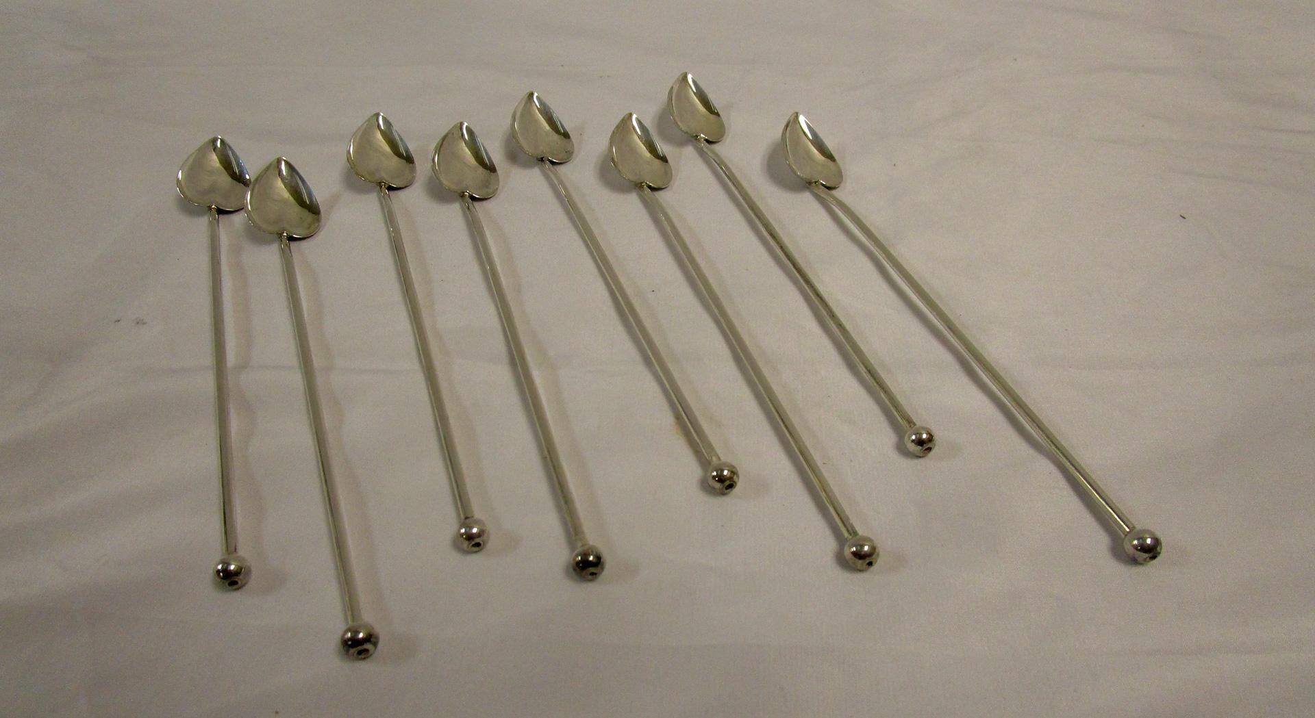 Handsome sterling silver straws featuring heart shaped spoons to assist in the stirring and drinking of beverages including those like the mojito and the mint julep, which are famous for getting bits of mint stuck at the end of the straw. This set