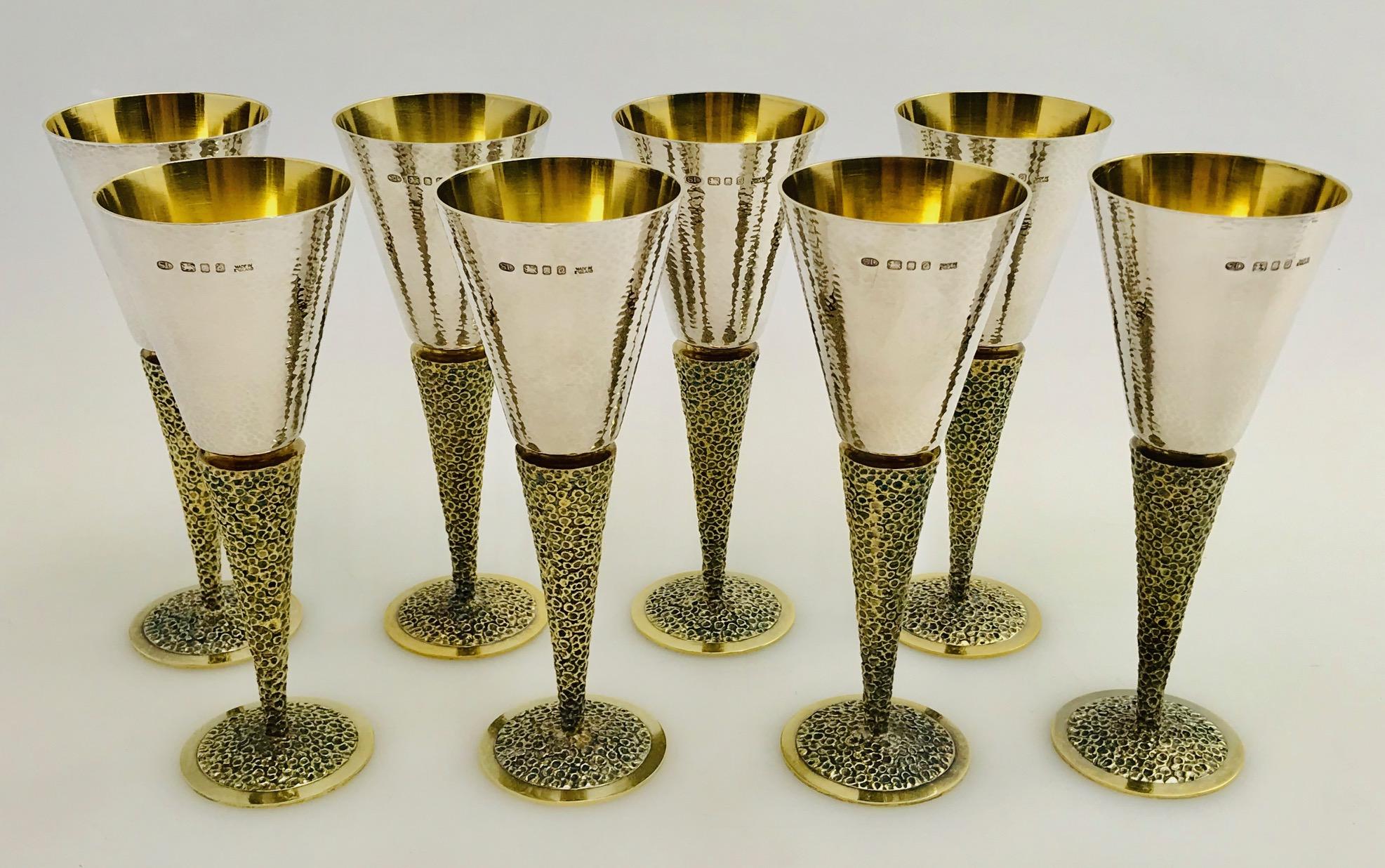 A set of 8 silver goblets made by the renowned English silversmith Stuart Devlin in London, 1969.
The stem is wonderfully textured and finished in silver-gilt and the bowls have a delightful hammered finish.