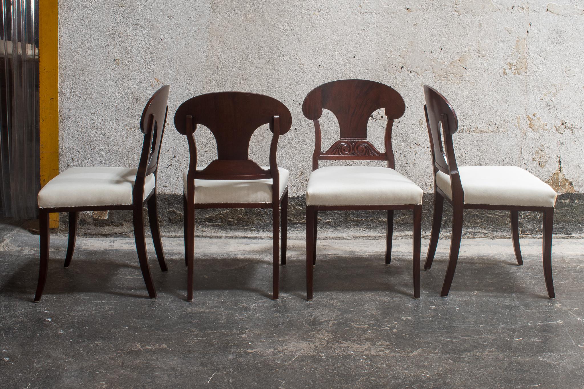 Swedish Karl Johan (Biedermeier) Revival Napoleon Hat Dining Chairs. Shovel-shaped backrest with decorative scroll carved center bar. These mahogany dining chairs come in a rare set of 8, unusual for the period and perfect for today's dining rooms.