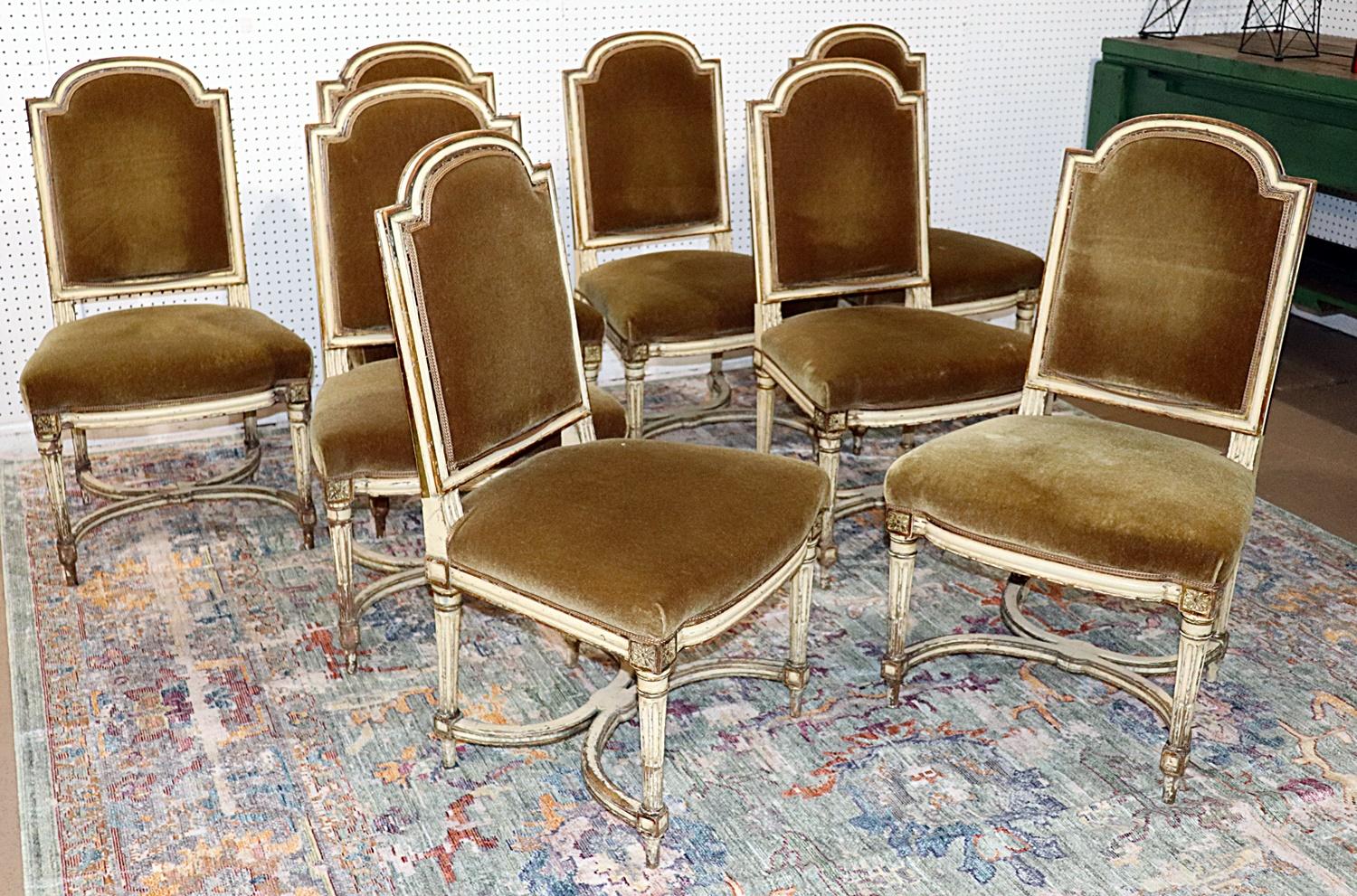 Set of 8 Swedish style distressed painted walnut side chairs with mohair upholstery.