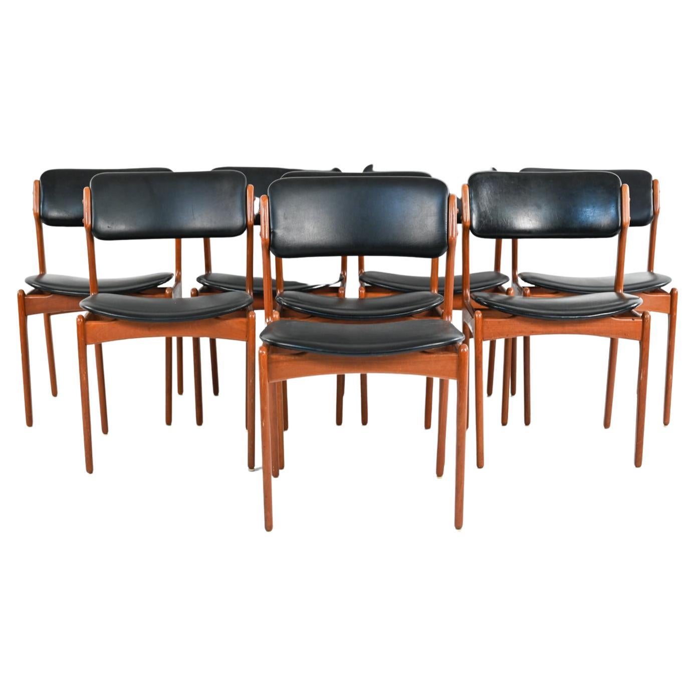 This iconic set of (8) side chairs designed by Erik Buch for Oddense Maskinsnedkeri features sculptural wood frames in solid teak, with 