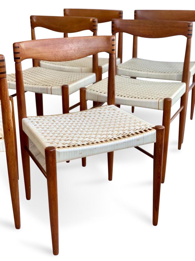 Beautiful rare set of 8 Danish teak wood dining chairs designed by H.W Klein for Bramin with cream woven silk seats. 

Very good vintage condition with solid frames.