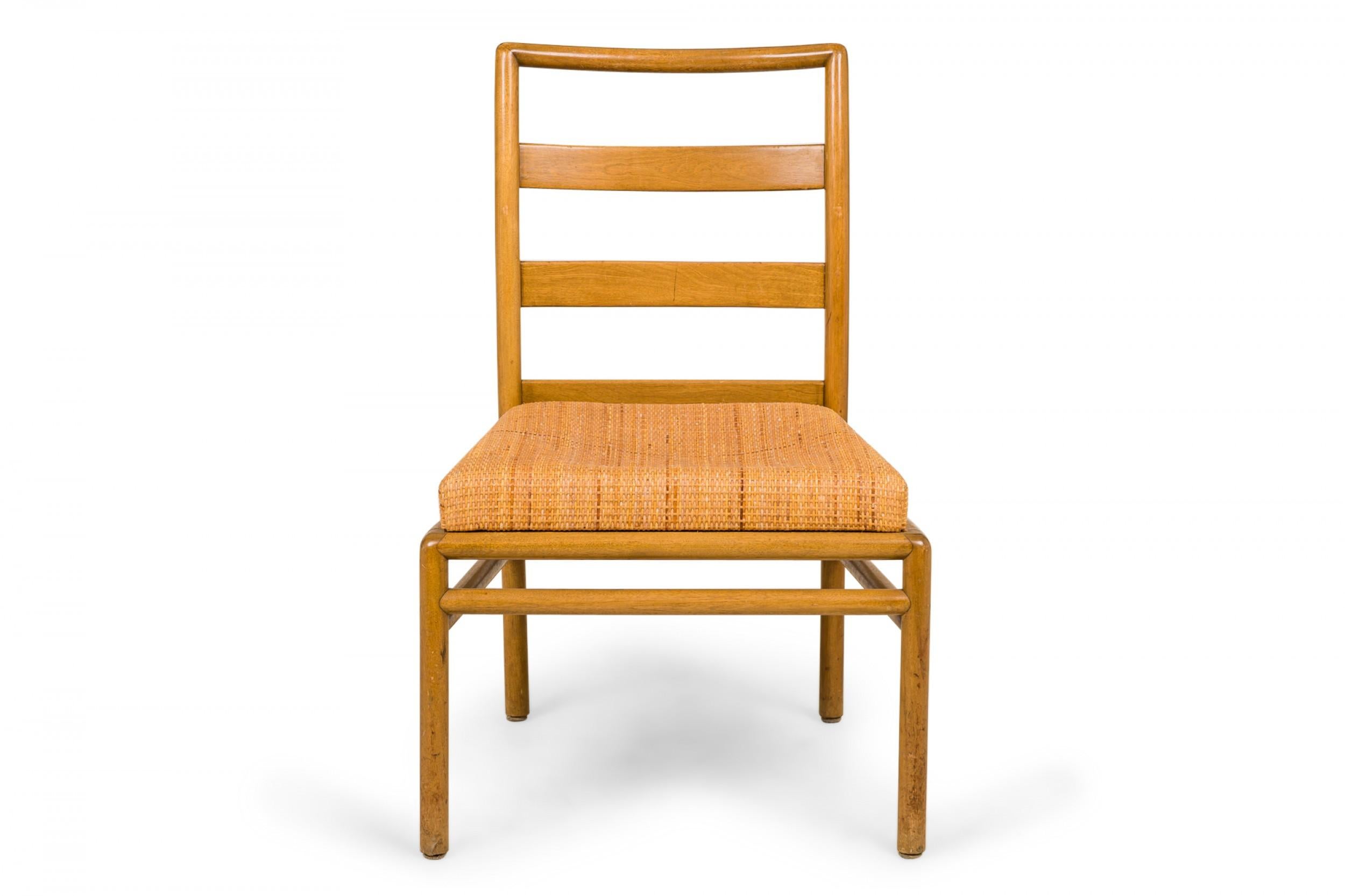 SET of 8 American mid-century dining side chairs with light wooden frames, woven rattan seats, and ladder backs, resting on four dowel legs with stretchers. (T.H. ROBSJOHN-GIBBINGS FOR WIDDICOMB FURNITURE COMPANY)(PRICED AS SET)
