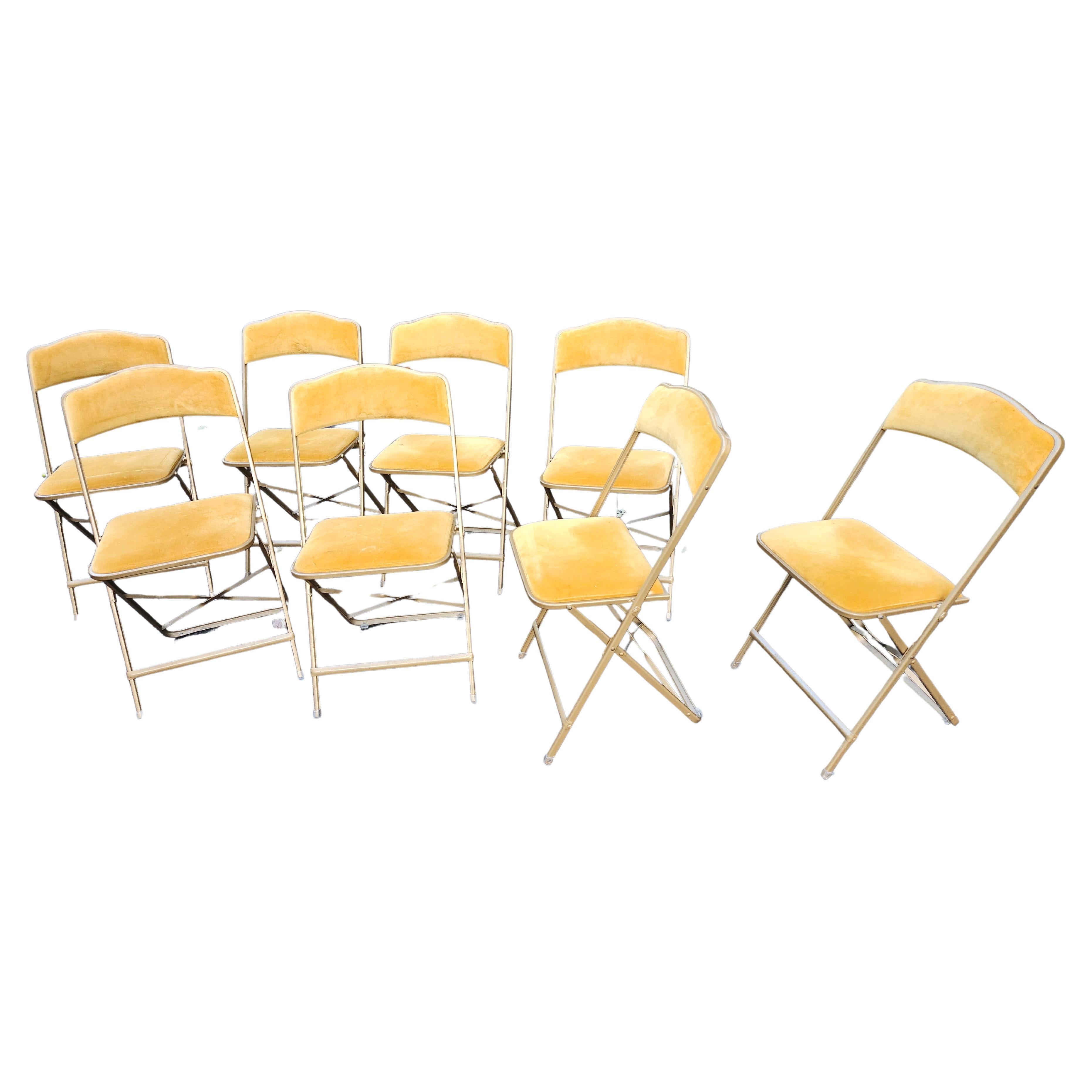 Fabulous set of 8 premier metal folding chairs in gilt like gold tone metal and gold velvet fabric. Very strong but lightweight and easy to use and store. Virtually foldup in a few inches of space. Stylish and comfortable,  not your average folding