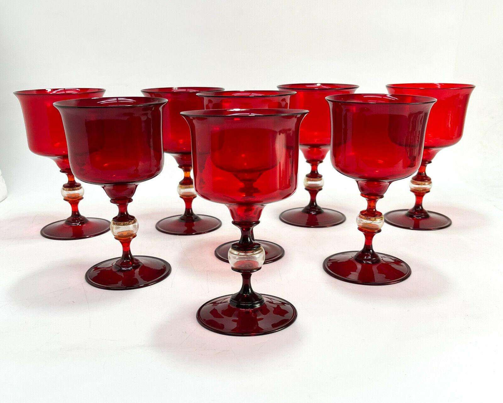 Set of 8 Venetian Cranberry red & gold fleck art glass wine goblets, Salviati

Blown stemware comprising of 4-5 pieces with a clear gold fleck bulb to the stem. Polished pontil to the underside.

Additional information:
Material: Glass 
Type: