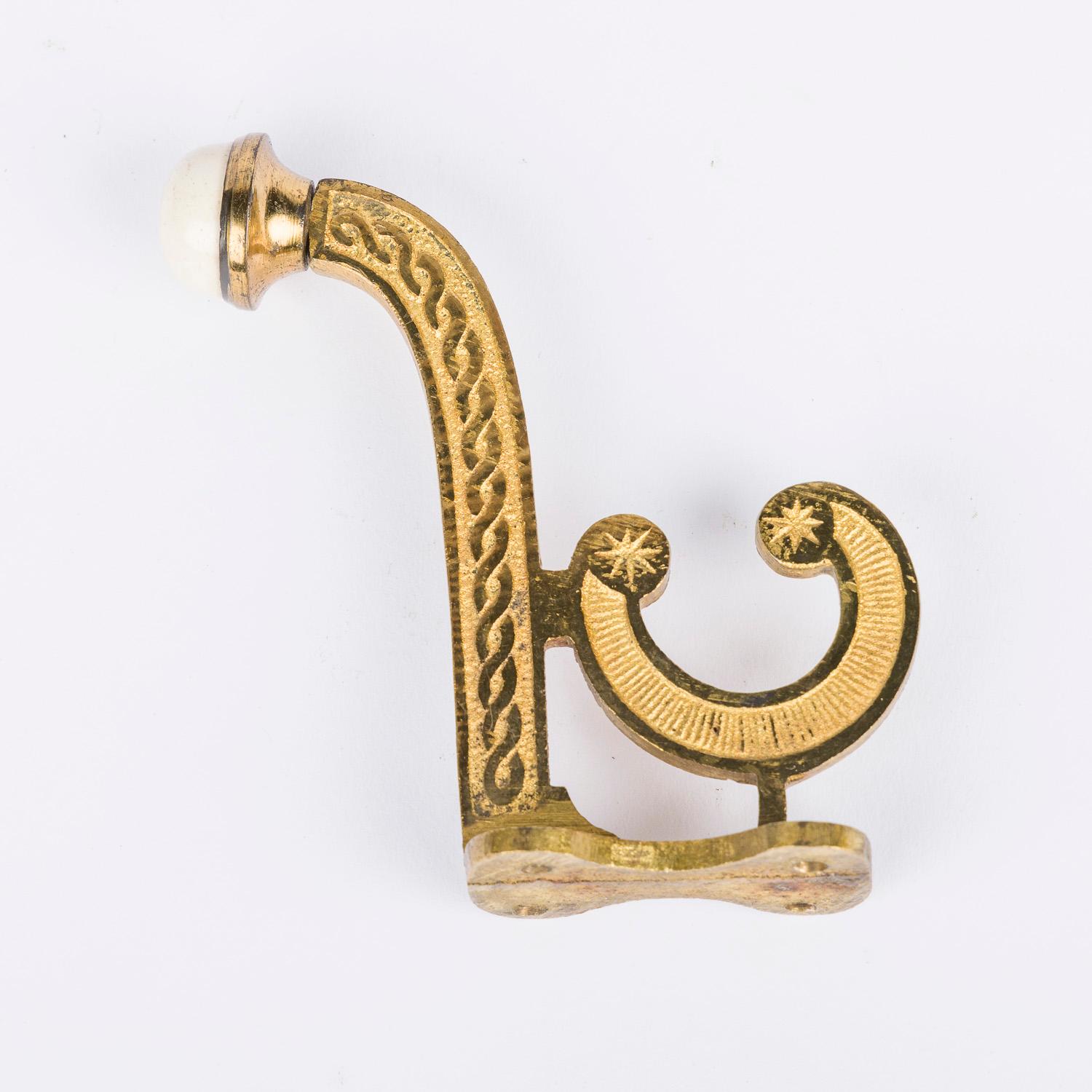 Gilt Set of 8 Victorian gilt brass hooks with white porcelain finials. For Sale