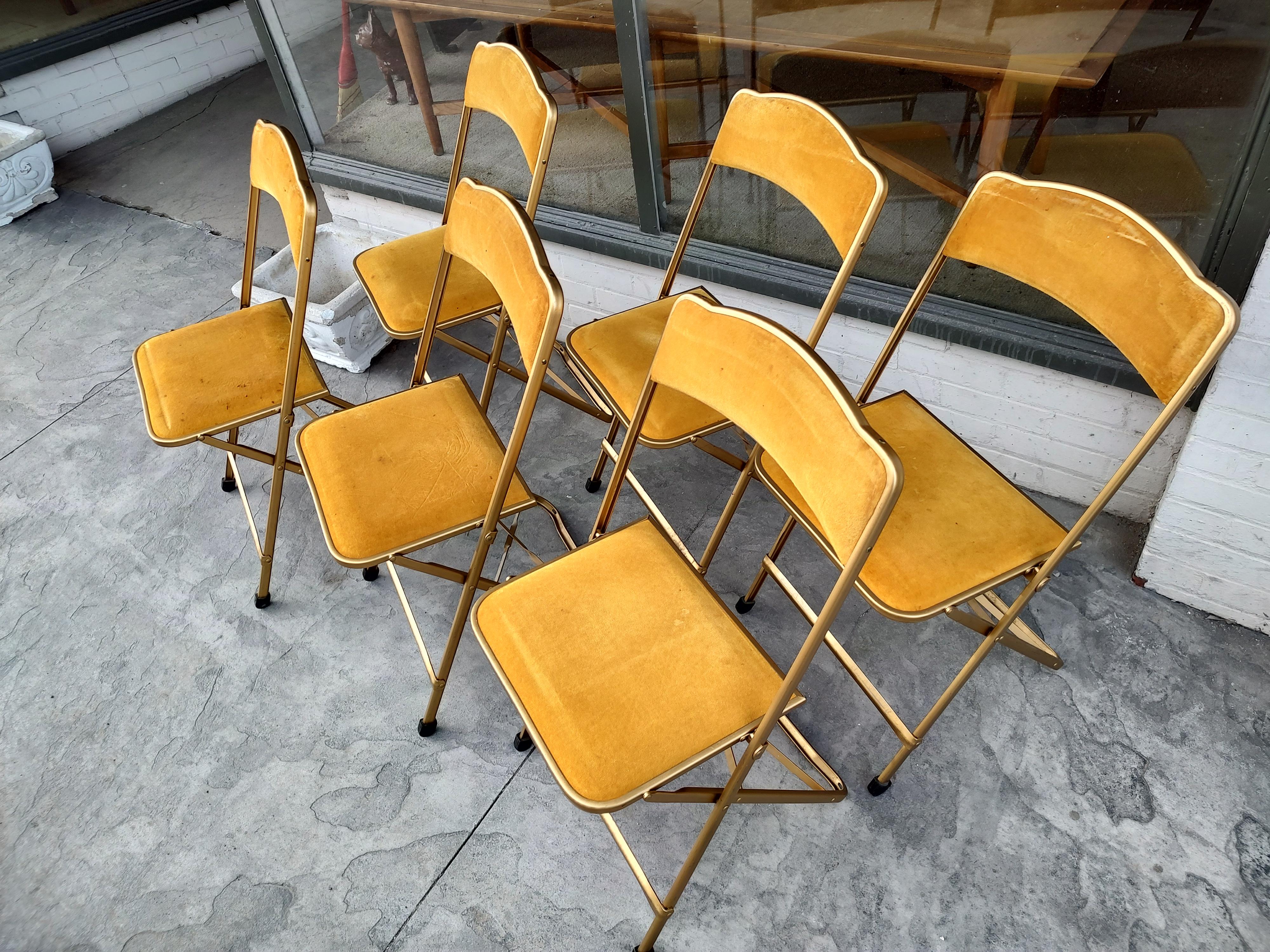 Beautiful set of eight mid century Plia style folding chairs in velvet upholstery. Made in NYC c 1955 by the A. Fritz co. Fold flat, 1 inch in depth. In excellent vintage condition with minimal wear. Rubber tips on 7 of the 8 chairs.