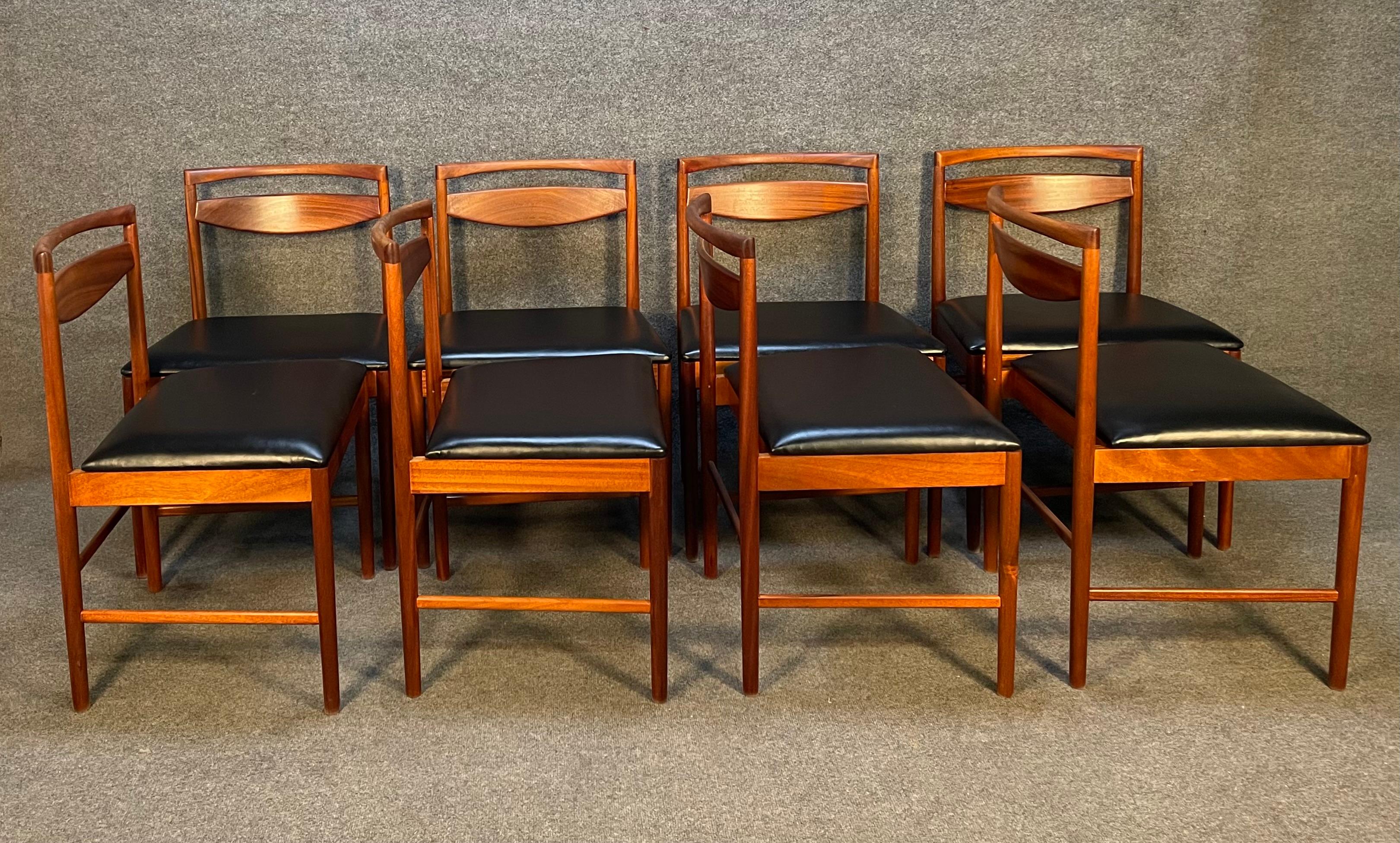 Here is a terrific set of eight British Mid-Century Modern dining chairs in mahogany Model 9433 manufactured by A.H. McIntosh in Scotland in the 1960s.
This comfortable set, recently imported from Europe to California before its refinishing,