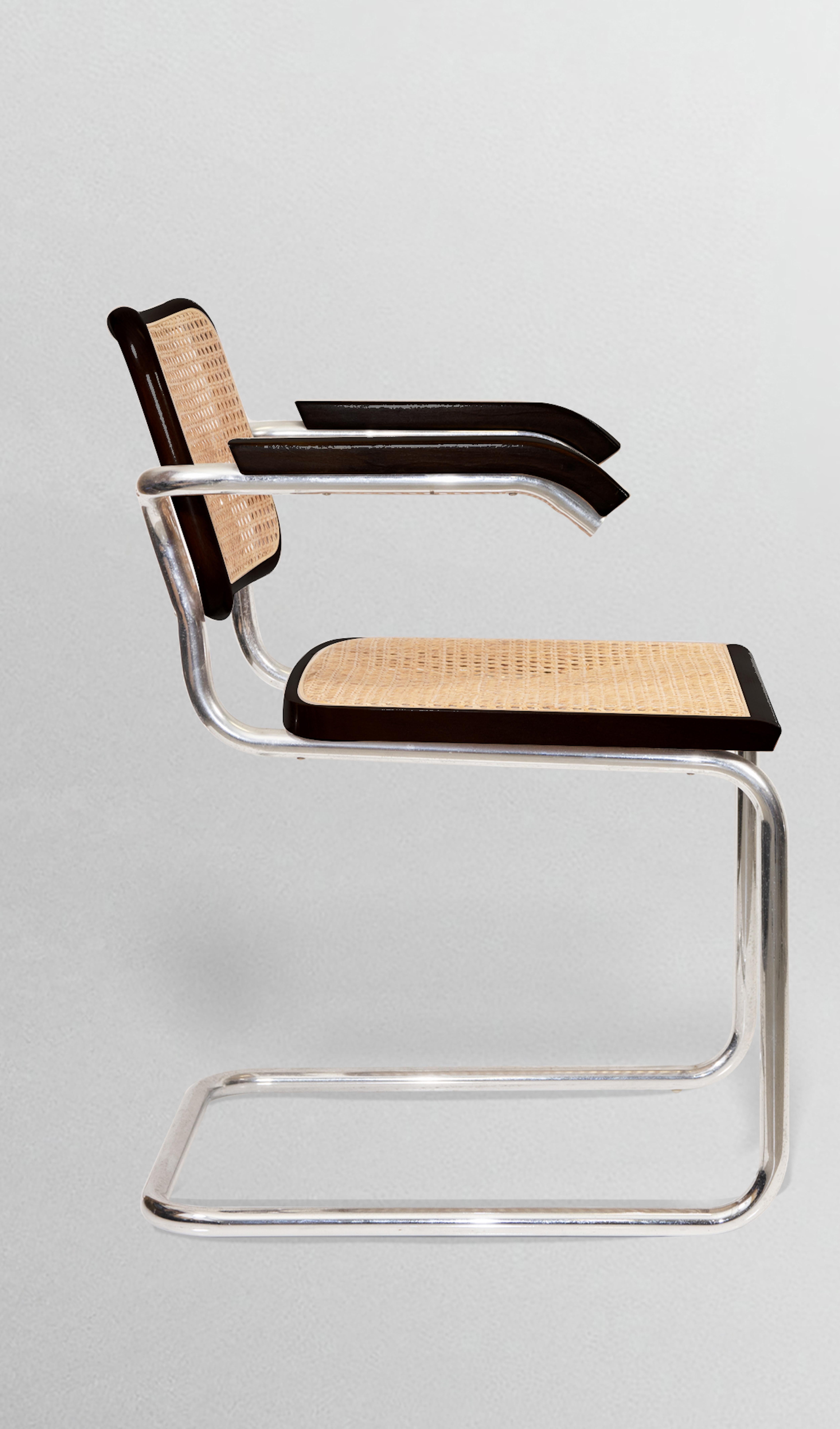Cesca Chairs is a set of 8 chairs designed by Marcel Breuer and realized by Dino Gavina in the 1970s.

Load-bearing structure in mannesmann-type continuous tubular steel, cold-bent chrome-plated. 
Seat and backrest made of black lacquered wooden