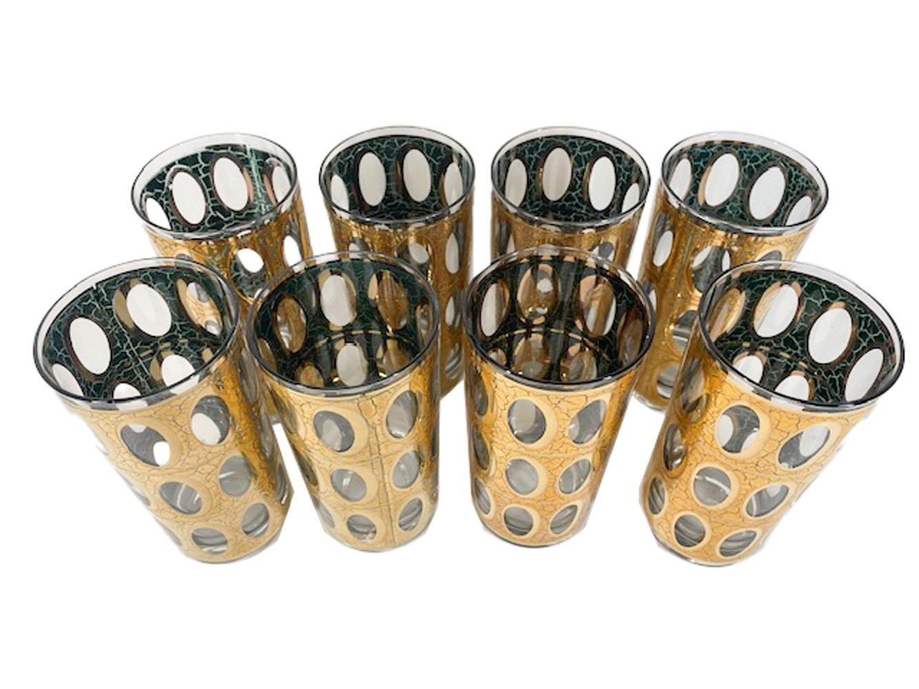 Set of 8 Mid-Century Modern highball glasses by Culver, LDT, in the Pisa pattern, decorated in crackled 22k gold over translucent green enamel with rows of open oval 'windows'.