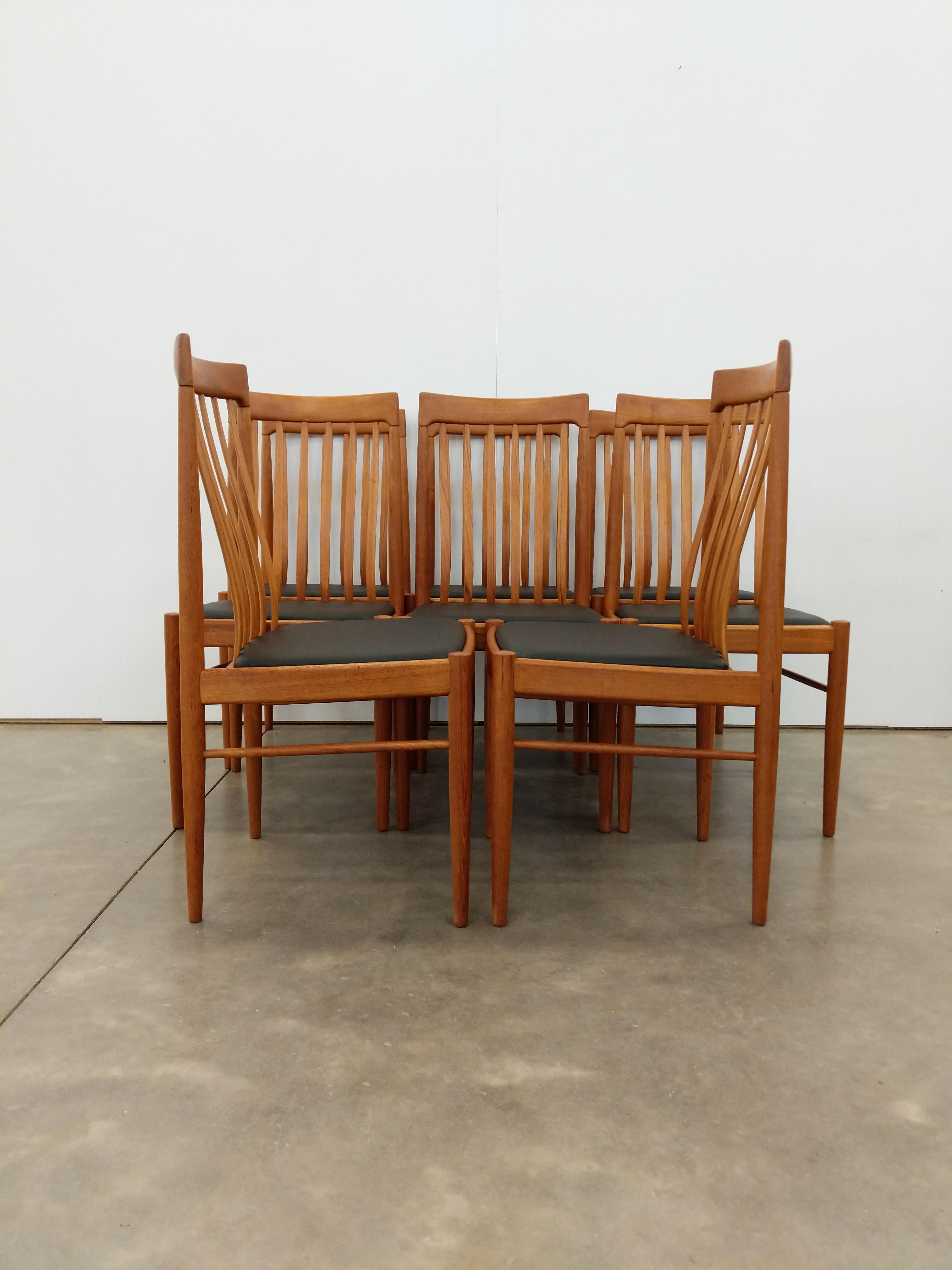 Set of 8 authentic vintage mid century Danish / Scandinavian Modern dining chairs.

By Bramin.

Maker's label on bottoms.

This set is in excellent condition with brand new vegan leather upholstery and very few signs of age-related wear (see