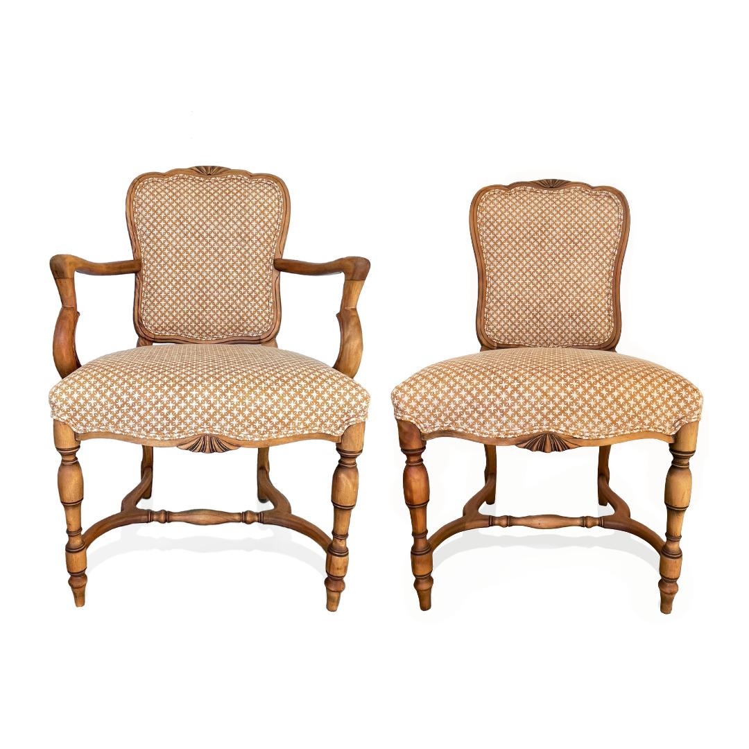 Elegant yet inviting this set of 8 vintage dining chairs is fantastic. It is a set of 6 ample side chairs and 2 handsome arm chairs. The chair frames have been stripped and waxed to highlight the beautiful wood grain and newly upholstered in a hand