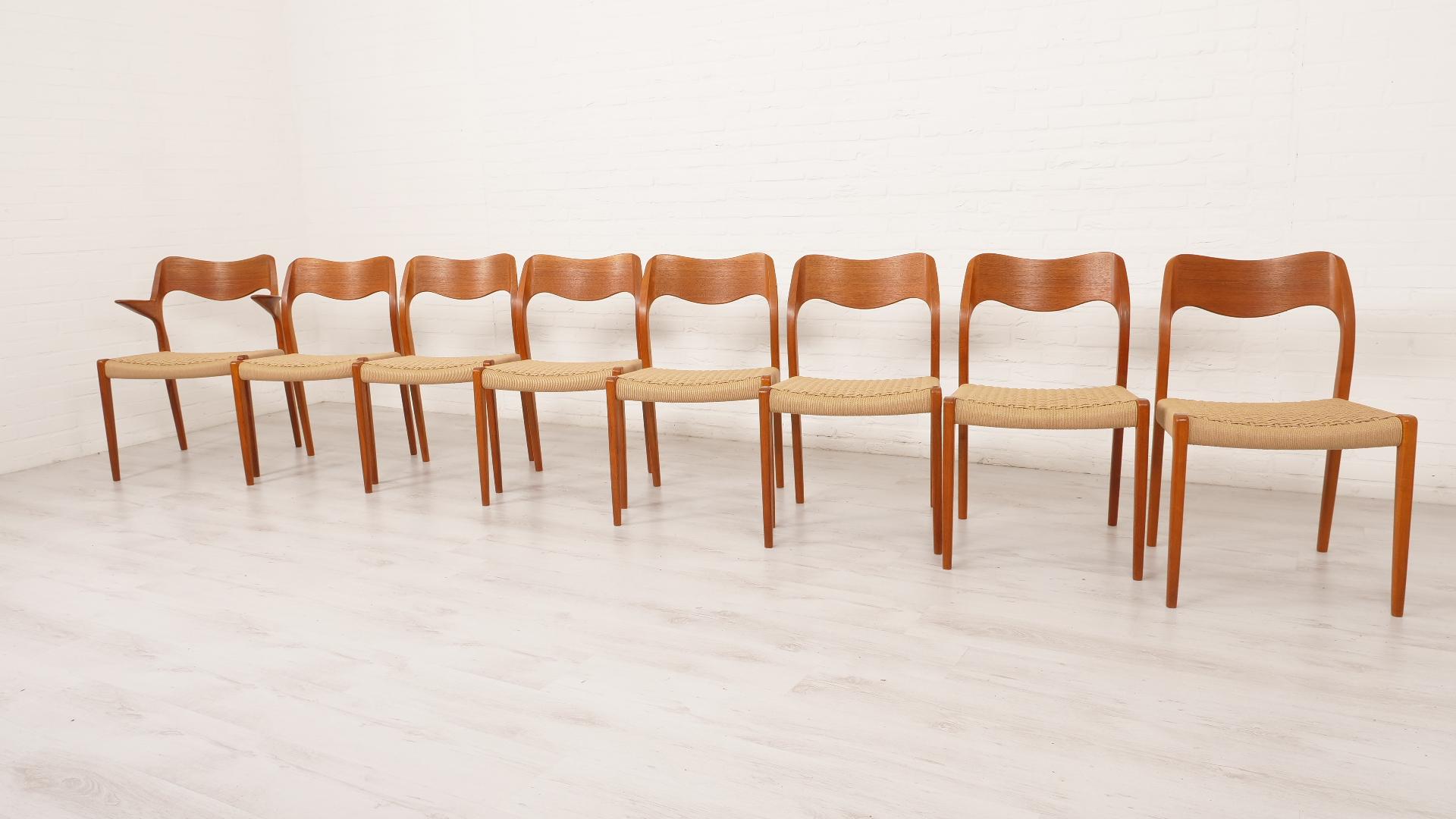 Set of 8 beautiful Danish vintage dining chairs. These chairs were designed by Niels Otto Møller. The set consists of 7 chairs in model 71 and 1 chair in model 55 (with armrests). The chairs are truly beautiful, the curves creating a timeless yet
