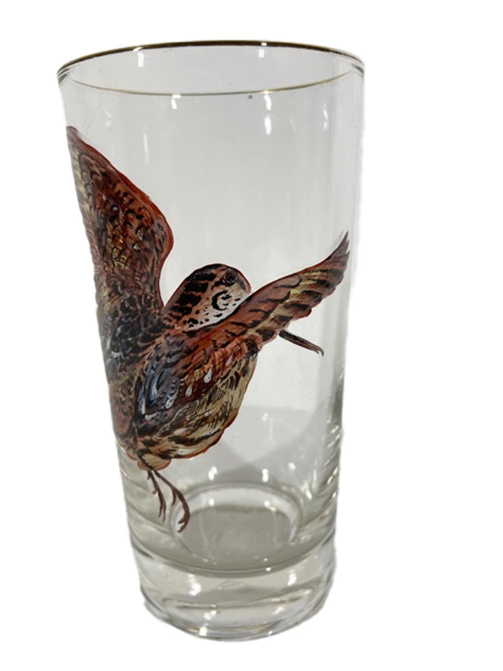 Eight vintage highball glasses designed by Ned Smith for Federal Glass, each hand painted with a different game bird and species name.
