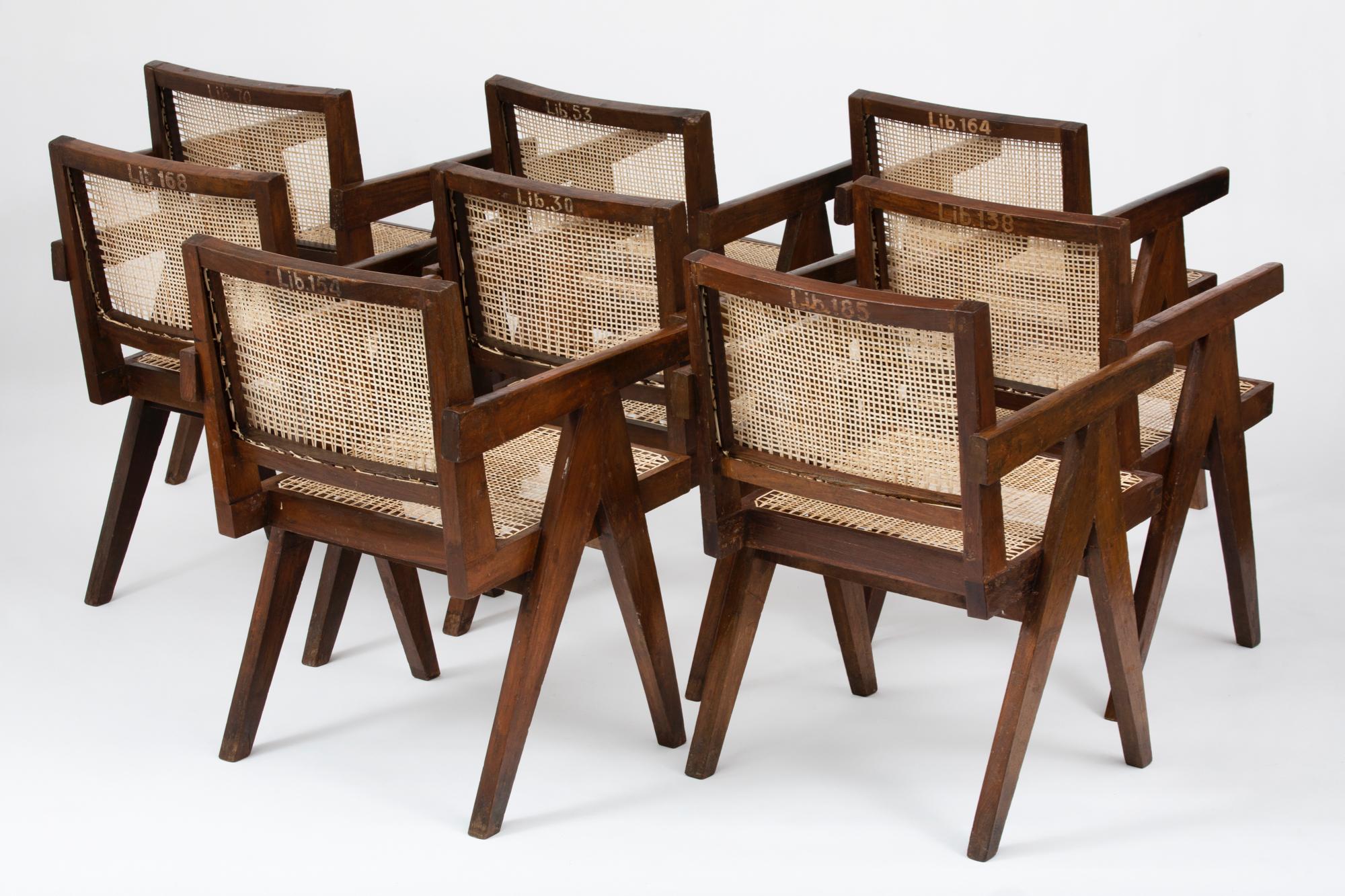 Original cane and teak armchairs designed by Pierre Jeanneret. These chairs were created for the famous modernist capital city of Chandigarh, India that was designed by Le Corbusier, Jeanneret, and their team. Model number PJ-SI-28-D

*Please