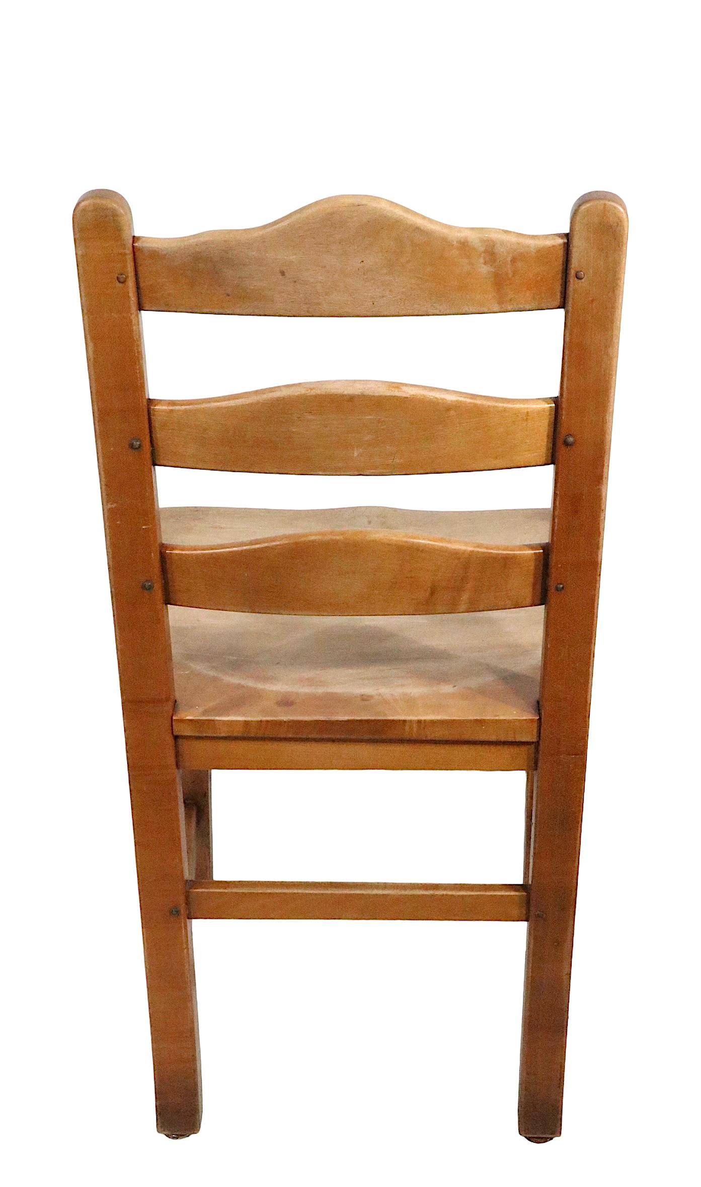 Set of eight vintage Stickley cafe, dining chairs in the Arts and Crafts, Farmhouse Modern style, constructed of solid maple. The chairs are circa 1950s some are marked Stickley Fayetteville - they are examples of the Cherry valley pattern, circa