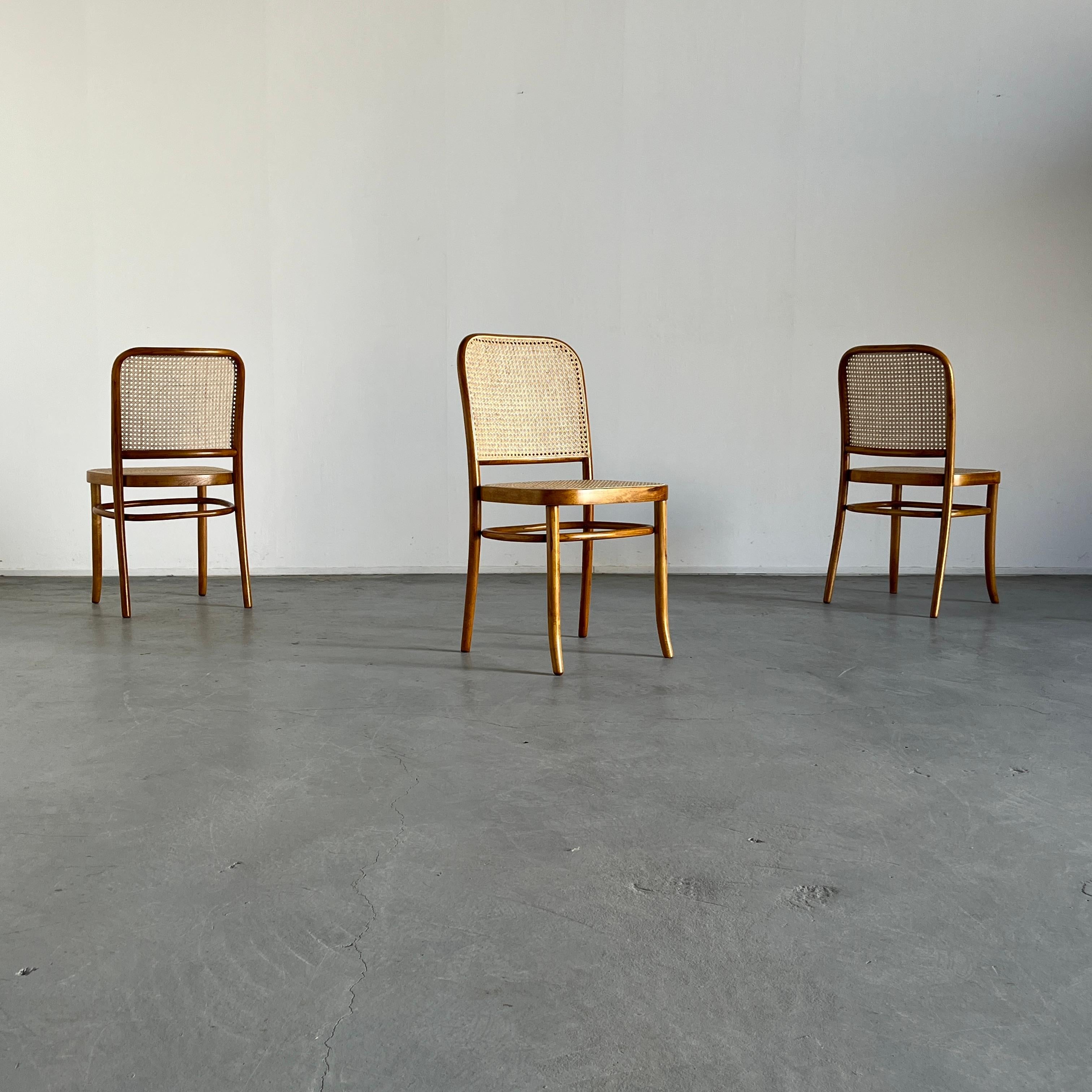 Vintage Prague dining chairs designed by Joseph Hoffman for Thonet.
A 1970s production by Thonet Mundus in Yugoslavia.
Bentwood beech and wicker cane.

Fully restored in natural wood gloss finish.
New European handmade wicker cane.
Unattributed.

12