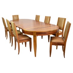 Conjunto de 8 sillas de comedor de nogal y cuero con mesa extensible de André Sornay