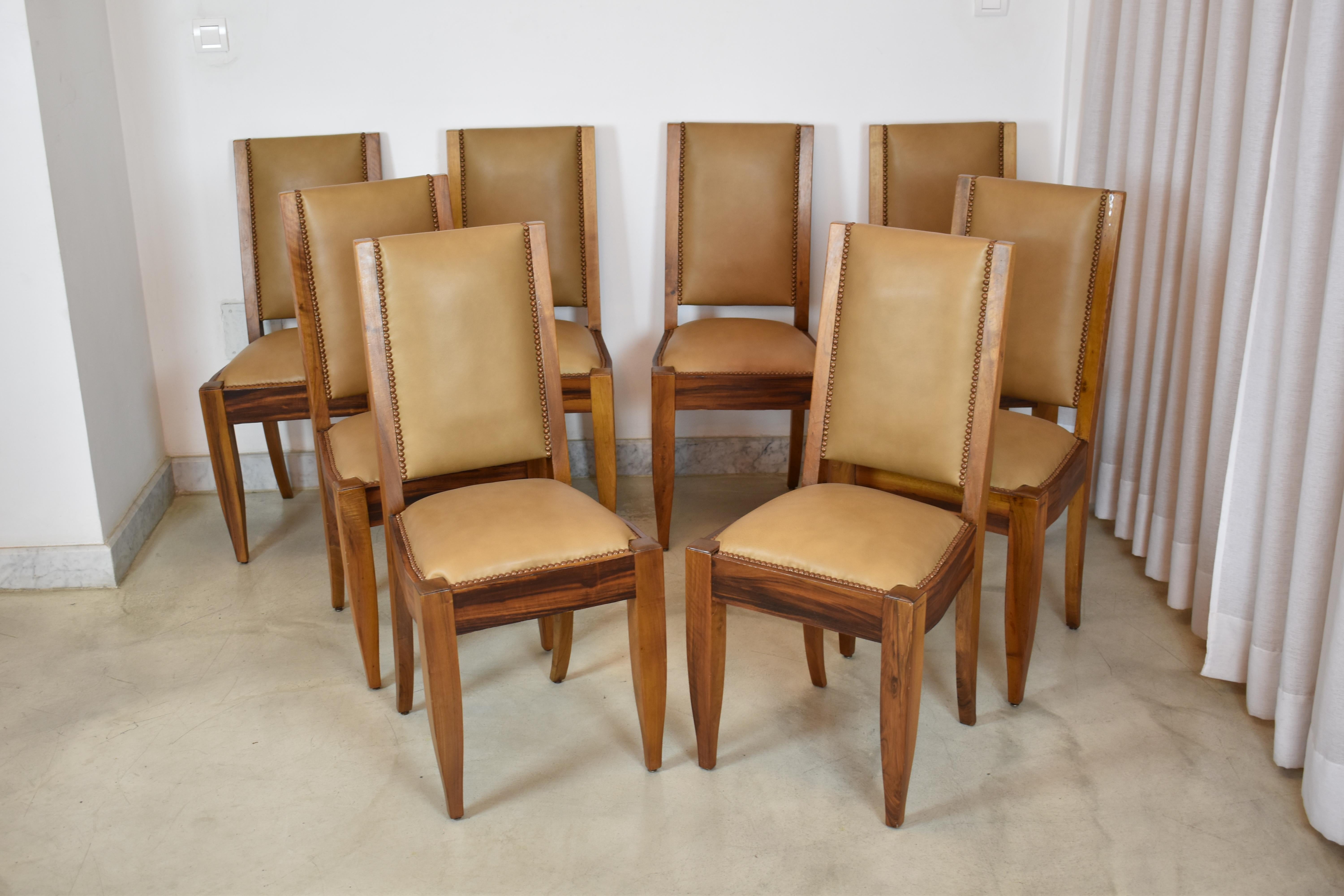 An exquisite set of eight dining chairs from the 1930s by notable french designer André Sornay, meticulously restored to their original splendor. 

Made out of rich walnut, these pieces have been impeccably refinished to highlight the natural beauty