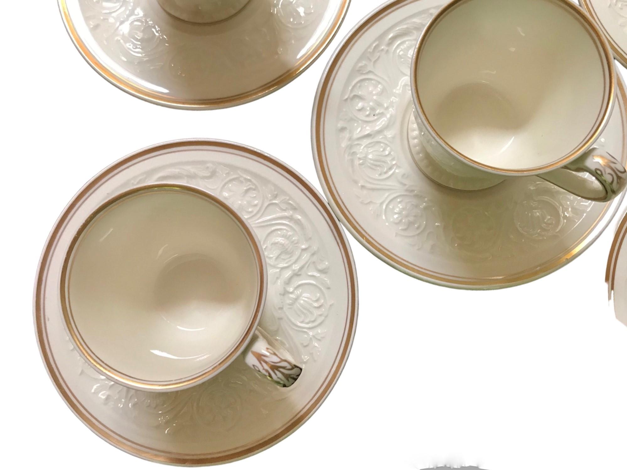 A set of Eight Wedgewood Patrician Gilt Pattern Demi-tasse Cups and Saucers. A very popular design from 1927 – 1986 for Wedgwood of Eutria & Barlaston, the Patrician Pattern of fine bone china dinnerware was produced in a mold of embossed flowers