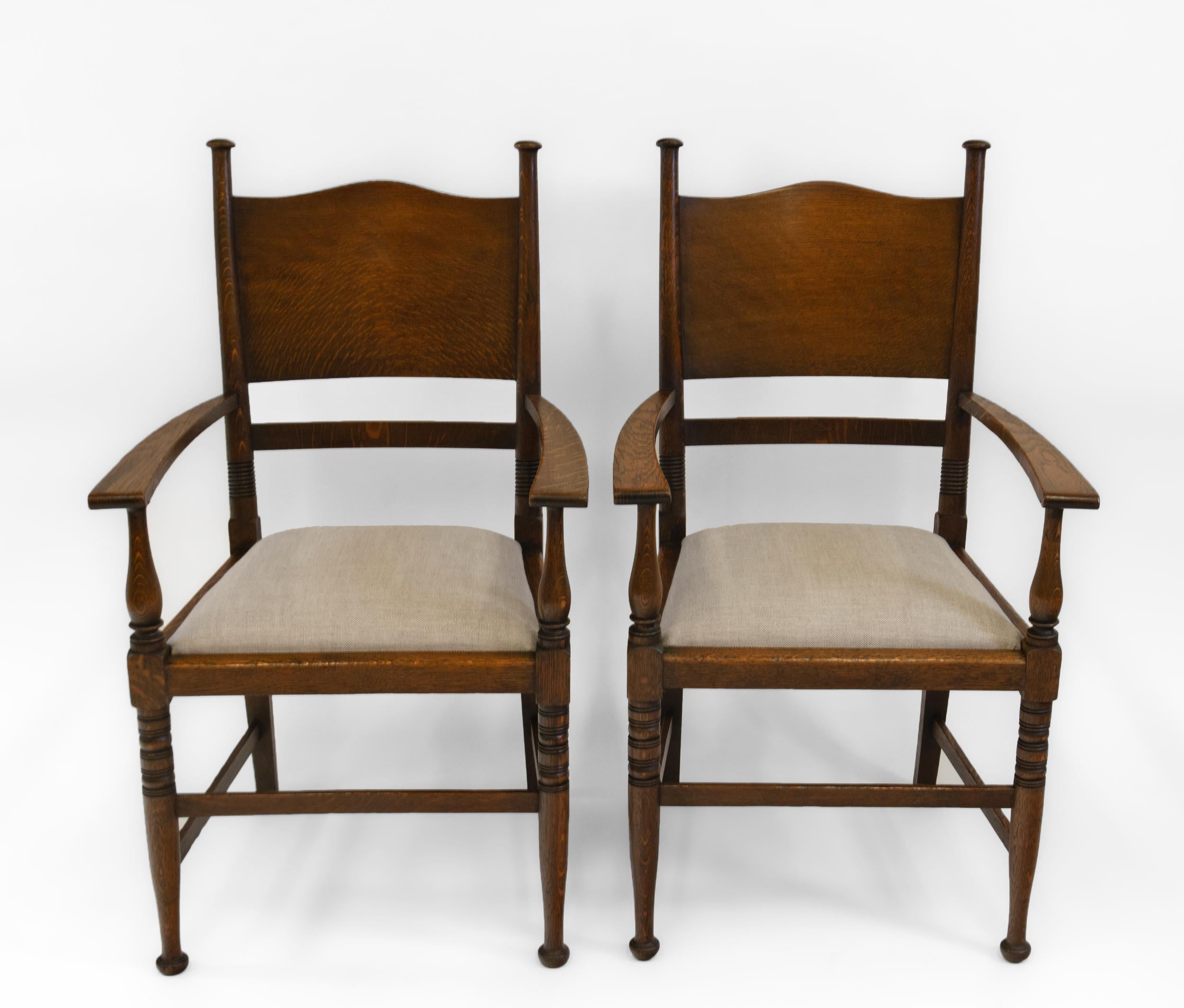 A set of eight Arts & Crafts chairs by William Birch. Retailer's label Waring and Gillow. Circa 1905. The labels all state Warings, along with Waring & Gillow, which would have been the time the two companies amalgamated. 

A genuine set of eight,