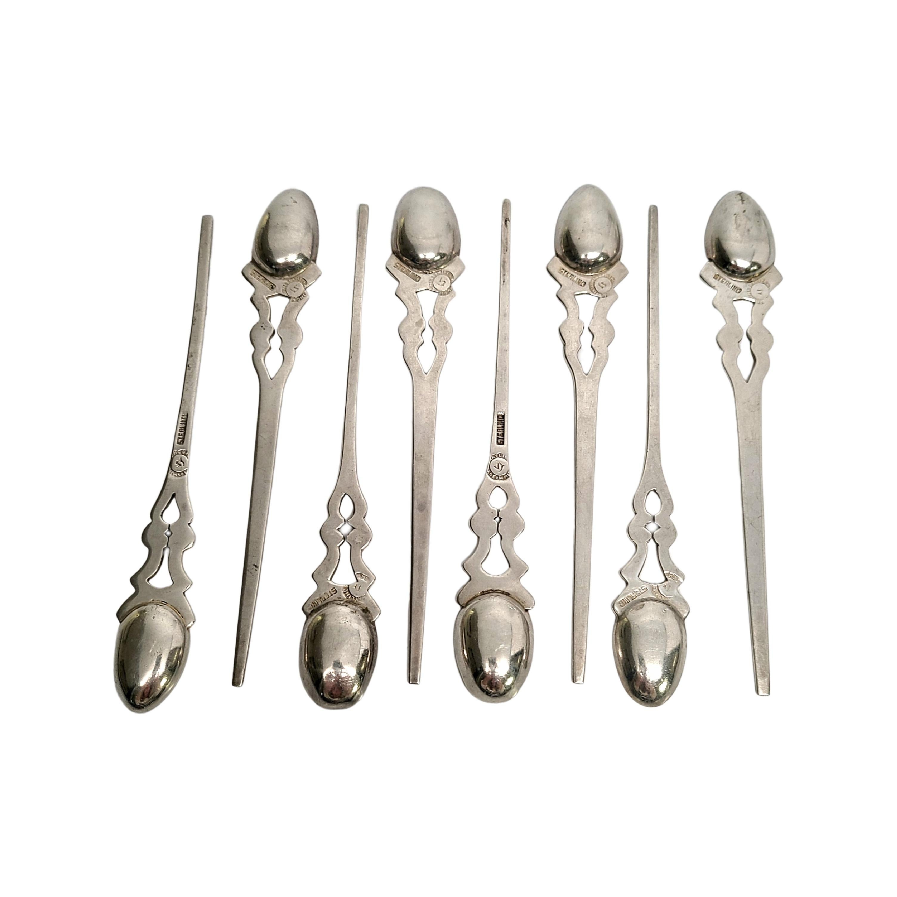 Set of 8 Taxco Mexico William Spratling sterling silver child's spoons.

Spoons feature small bowls but long handles with an openwork design and a slightly hammered finish in the bowls. Each spoon is slightly different due to being