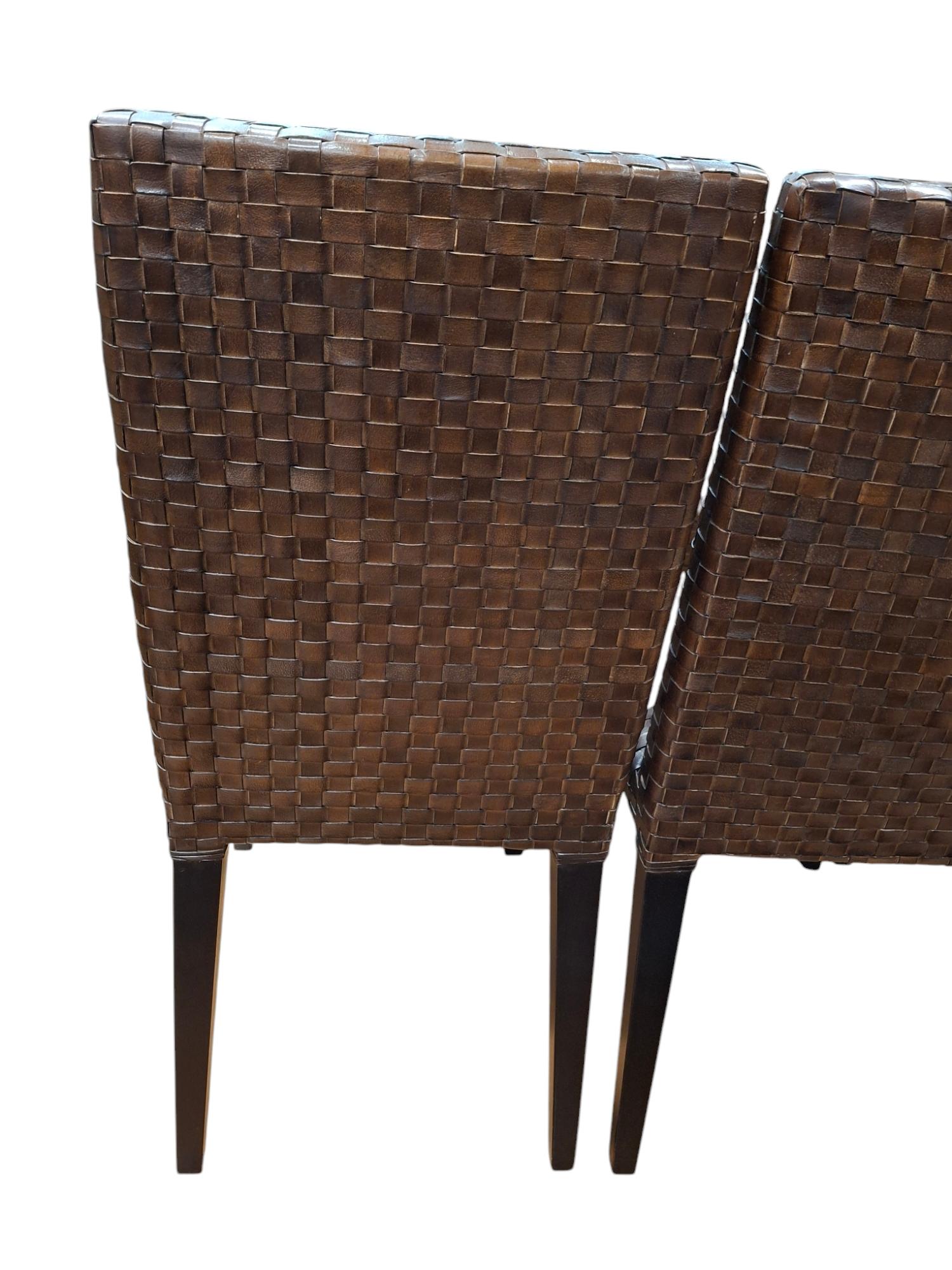 Set of 8 woven leather dining chairs by Stone International 
Made in Italy 