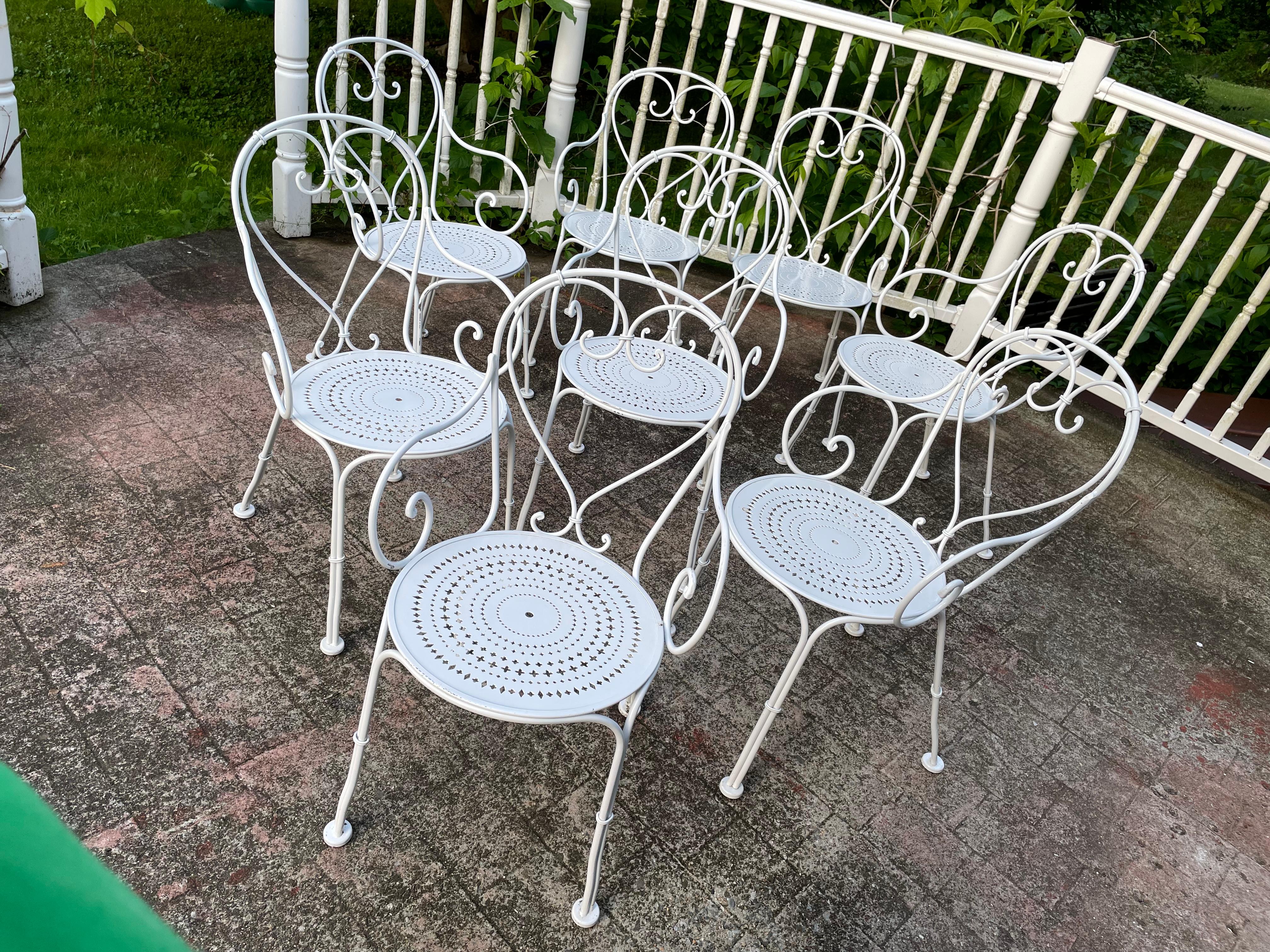 Set of 8 Wrought Iron French Cafe Chairs 
Perfect for your next outdoor gathering. Pair with one of our wrought iron 74” glass topped tables to enjoy dining service for 8. In stock and ready to ship today.