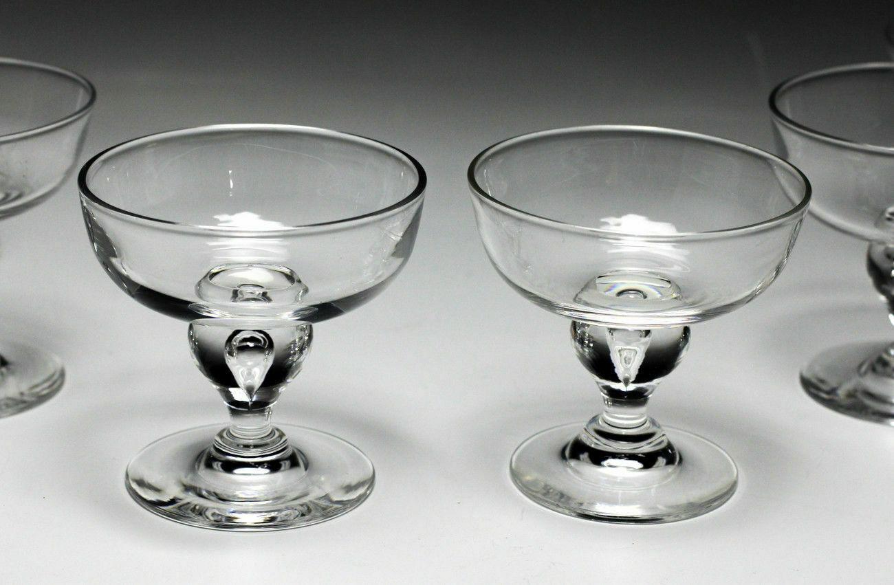 Set of 8pc set Steuben crystal dessert glasses compotes.

Invert recessed 'water drop' design.

Additional Information:
Material: Glass 
Type of Glass: Crystal
Production Style: Art Glass 
Brand: Steuben
Type: Compotes 
UPC: Does not