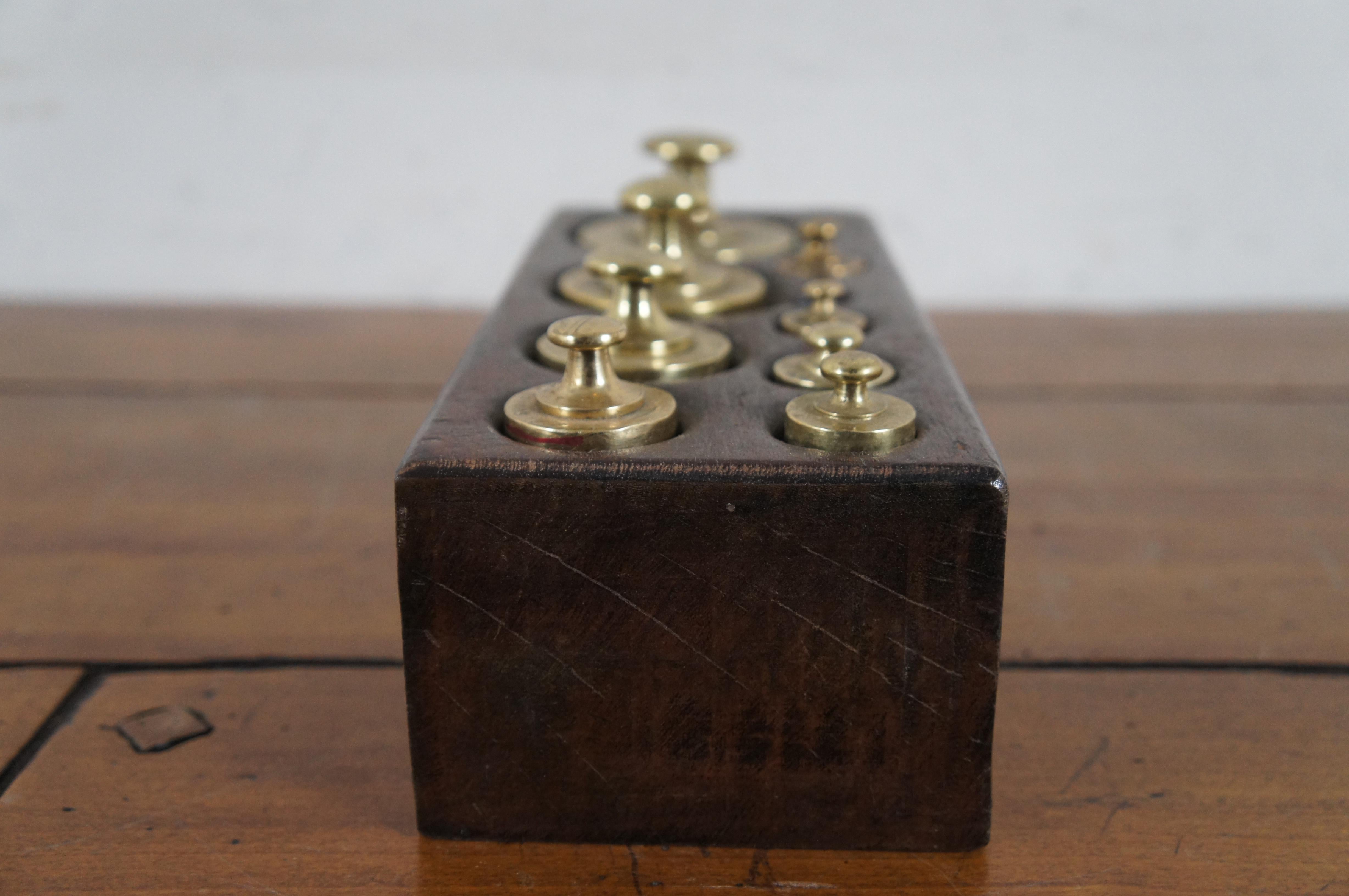Early 20th Century Set of 9 Antique Brass Scale Weights in Wood Block Apothecary 1920s For Sale