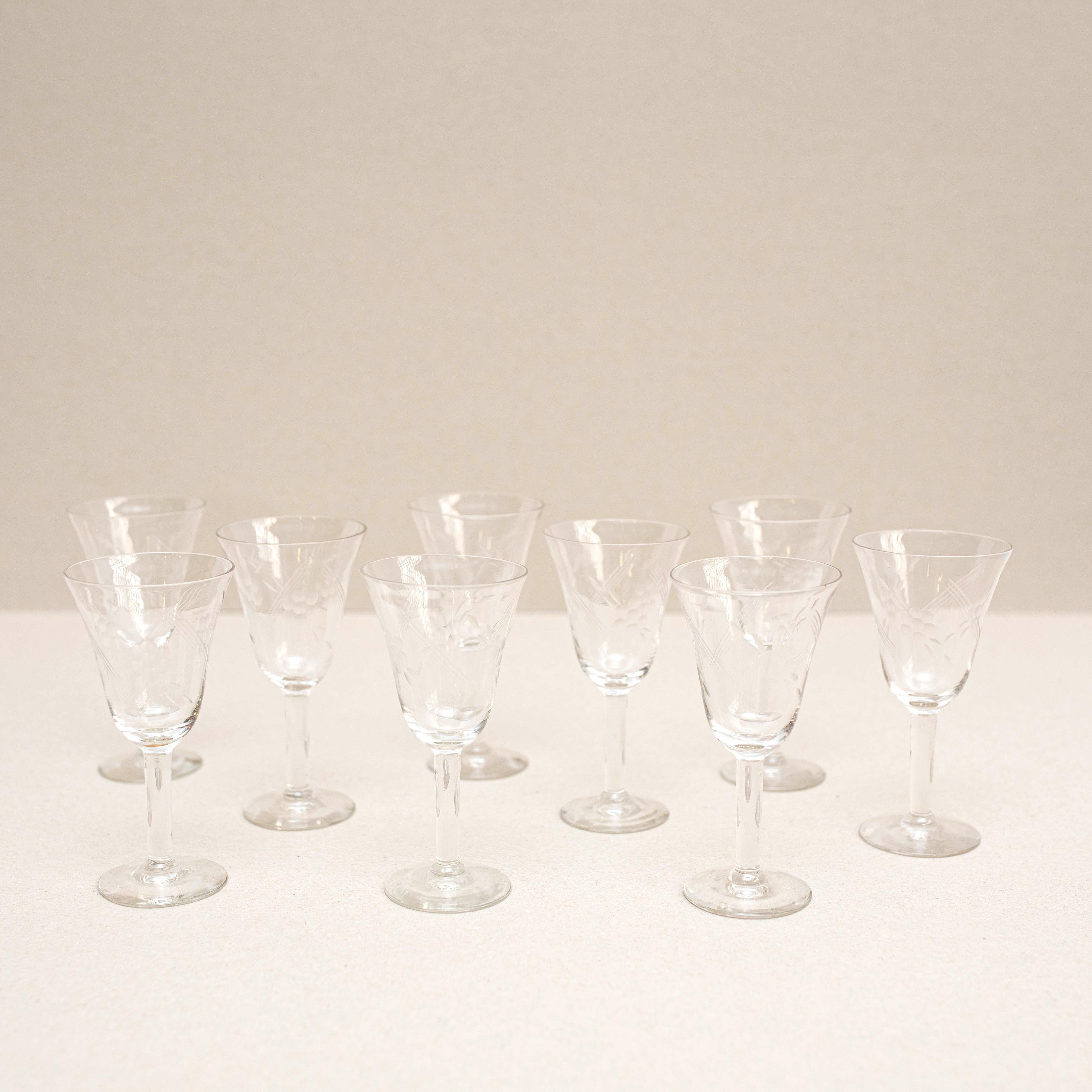 Set of 9 Antique glass wine cups.

Made by unknown manufacturer in Spain, circa 1970.

In original condition, with minor wear consistent with age and use, preserving a beautiful patina.

Materials:
Glass

Dimensions:
H 18 cm 
W 7 cm 
D