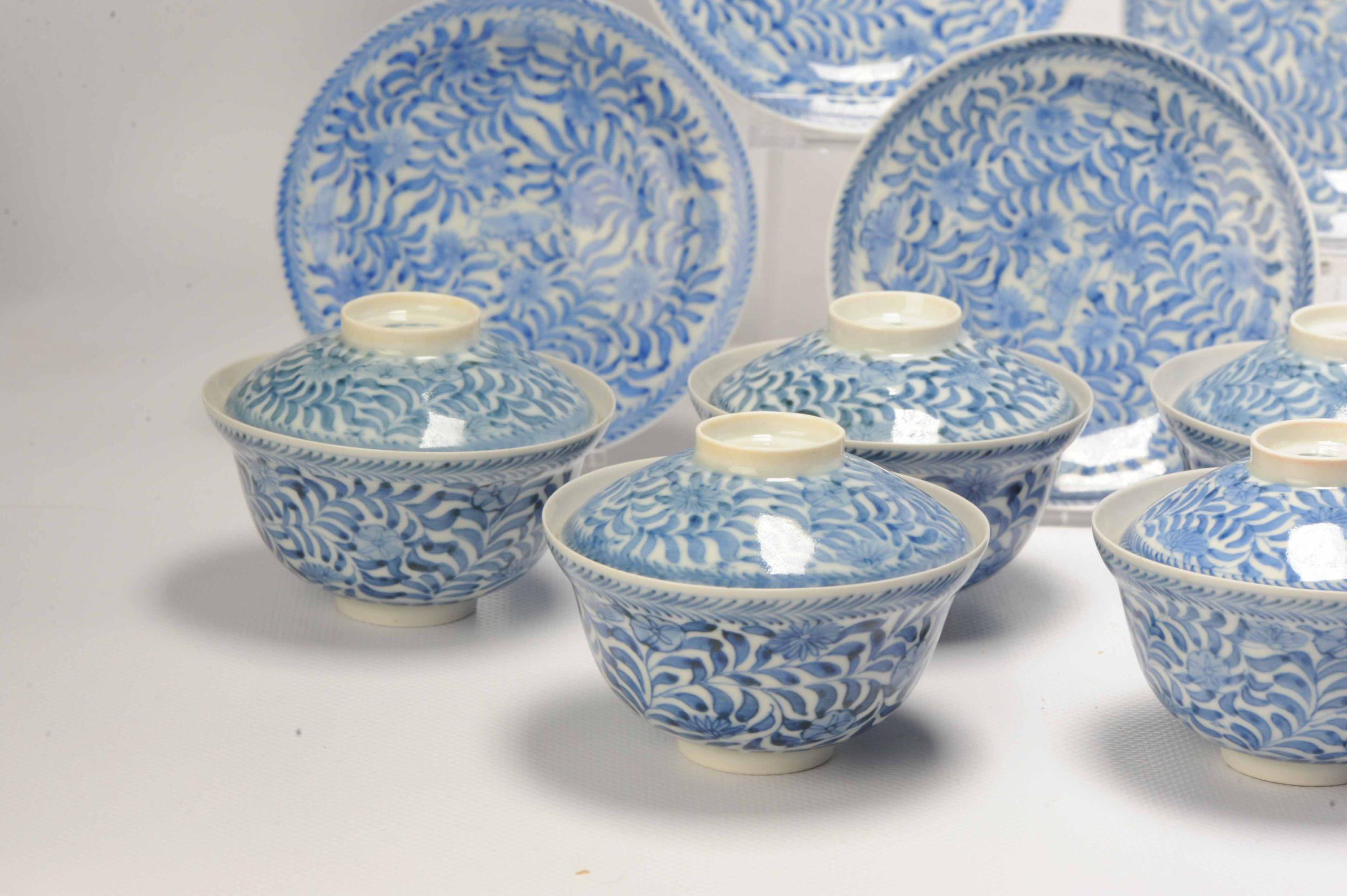 A very nice set of 9 gaiwan bowls decorated with parsley and butterflies. They are marked on the base with a six character mark.

Additional information:
Material: Porcelain & Pottery
Region of Origin: Japan
Period: 19th century Meiji Periode