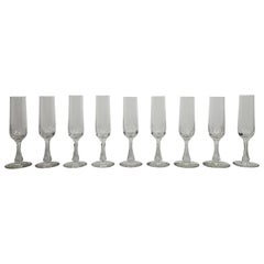 Ensemble de 9 charmantes flûtes à champagne en verre taillé, vers 1900