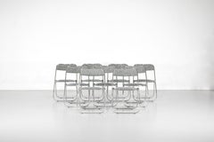 Set of 9 chrome folding chairs with fabric from the 1970s.